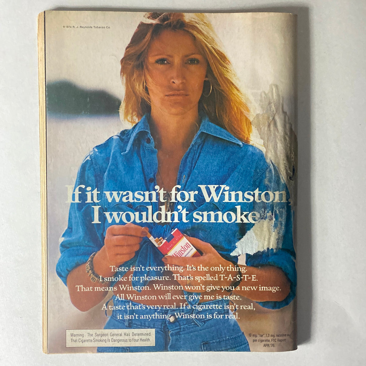Cycle World Magazine September 1976 advertisement page with a model promoting Winston cigarettes, reflecting the cultural attitudes of the 1970s.