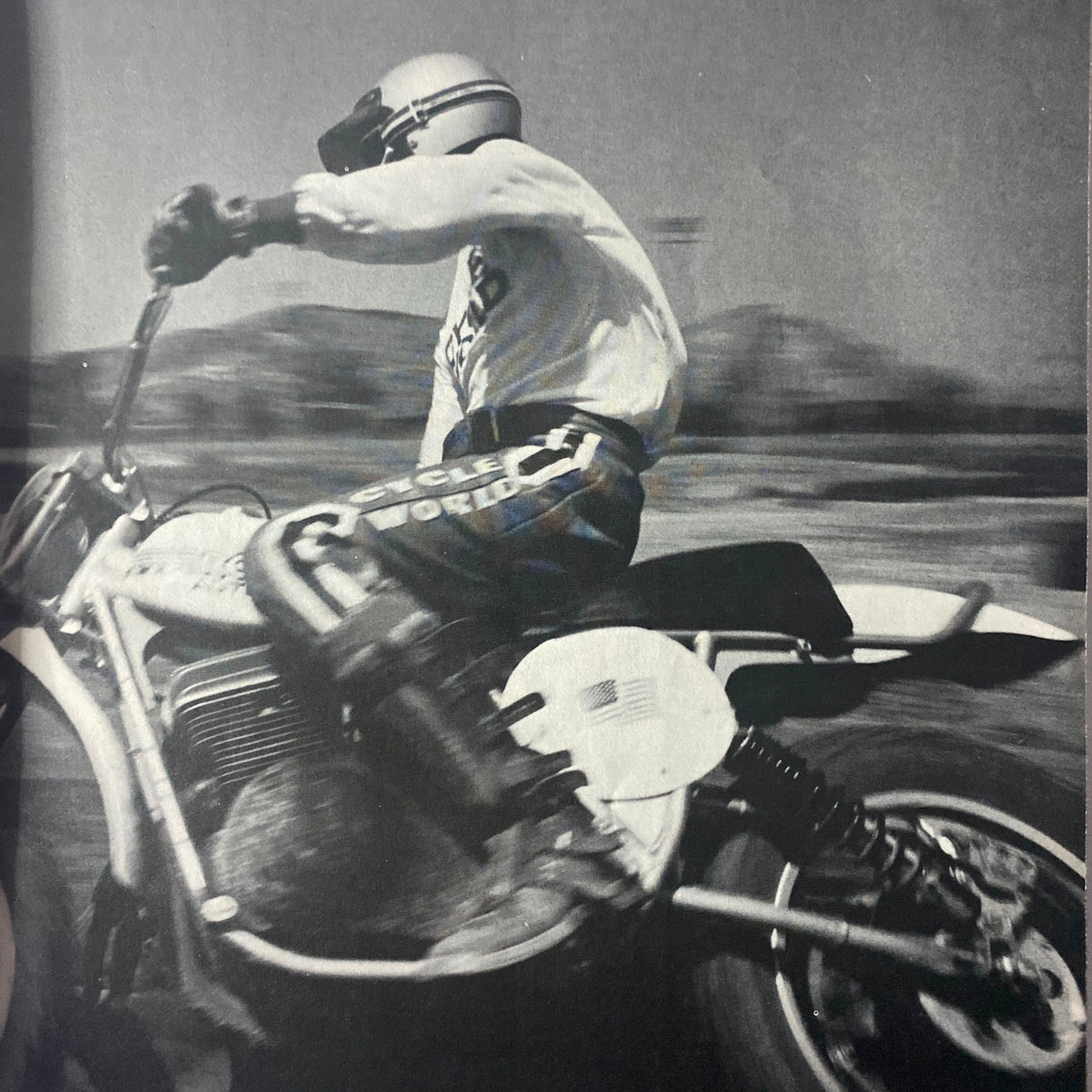 Action shot from Cycle World Magazine November 1975 showing a motocross rider on a motorcycle, highlighting dynamic movement related to Suzuki’s RM250 and 370 MXERS.