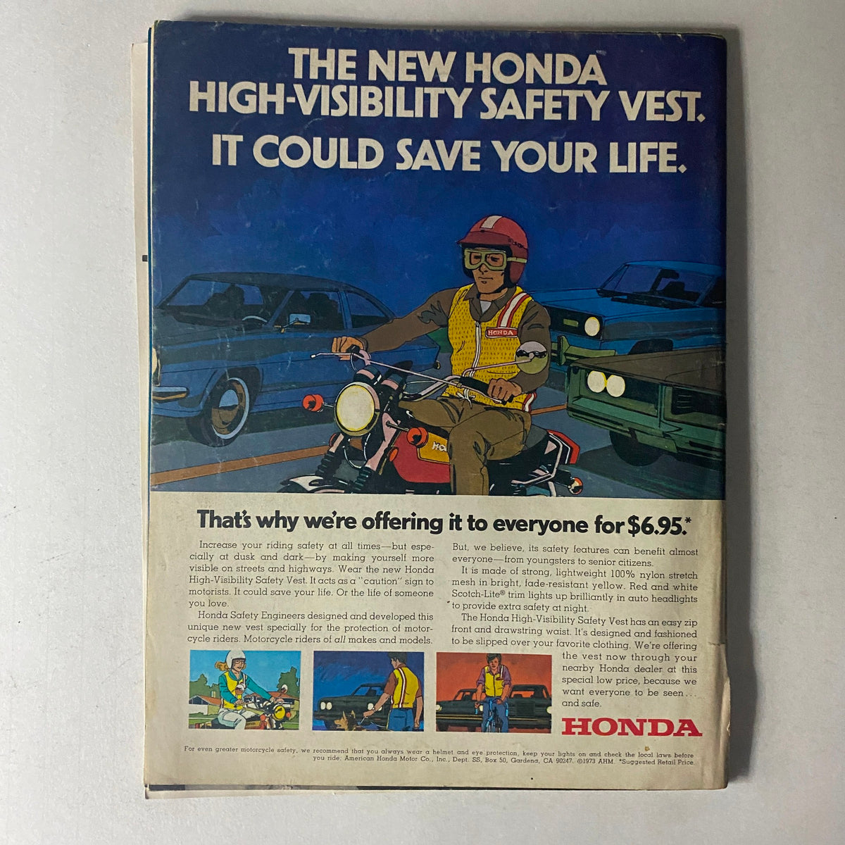 Vintage advertisement for the Honda High-Visibility Safety Vest, promoting motorcycle safety gear. Featured in the November 1973 issue of Motorcyclist Magazine, the ad showcases a motorcyclist wearing the vest, emphasizing safety while riding. This collectible magazine focuses on the Penton 175 Jackpiner and captures the motorcycle culture of the 1970s.