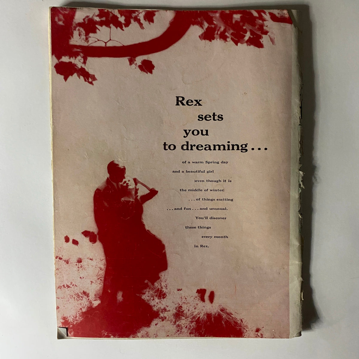 Cover page of Rex Magazine December 1957 with artistic design featuring a silhouette of a couple, emphasizing the magazine's theme of dreams and nostalgia.