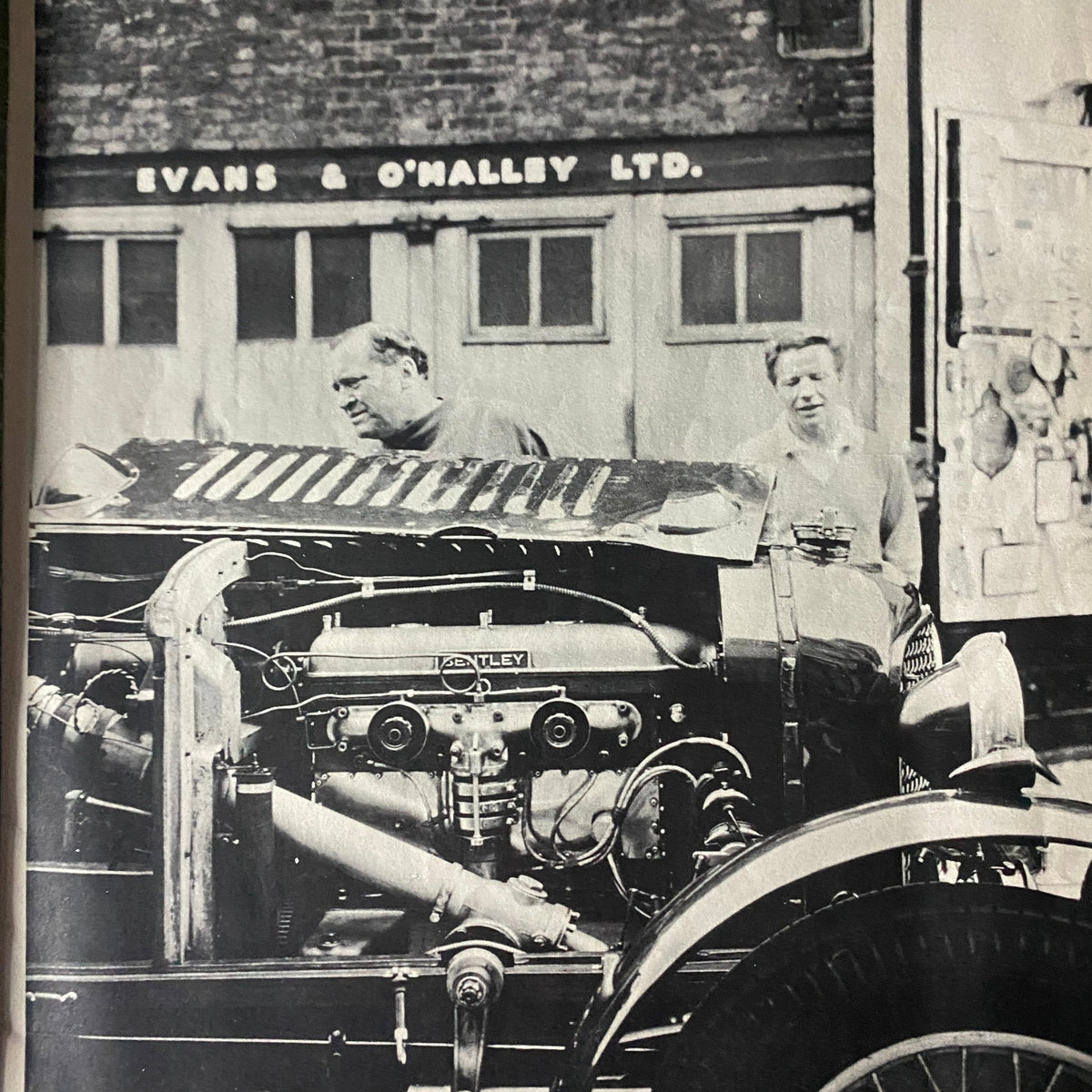 Historical photograph from the April 1962 Gentleman Magazine, highlighting mechanics working on a Bentley automobile, showcasing classic vintage automotive culture.