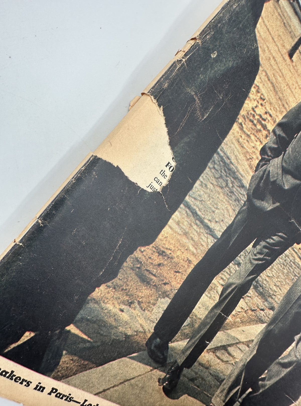 Close-up detail of The New York Times Magazine March 16, 1969 cover, highlighting damage with a tear on the edge near a photo of peacemakers Lodge and Walsh.