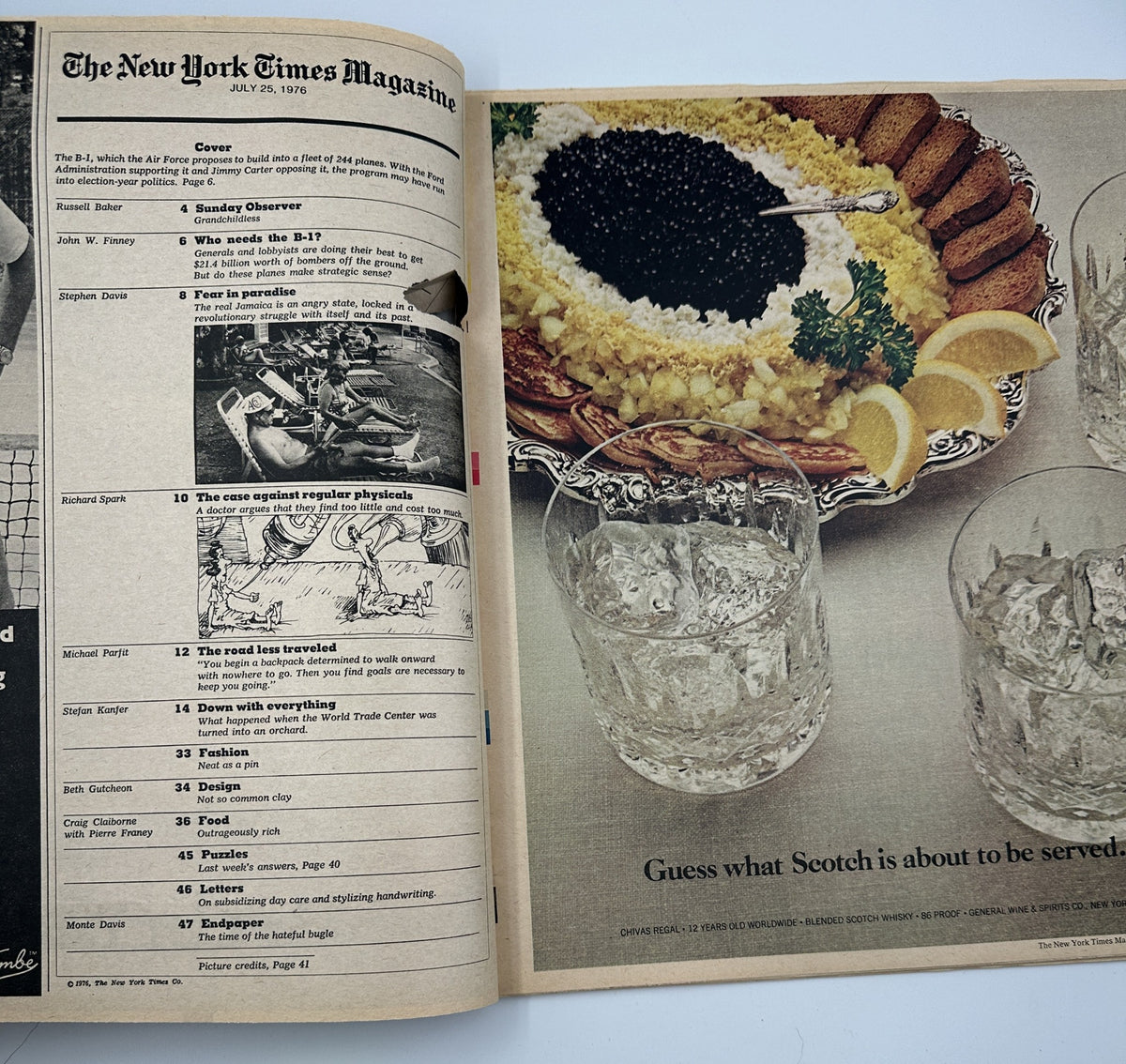 Inside spread of The New York Times Magazine July 25, 1976, displaying the Table of Contents and an image of a lavish dish alongside whisky glasses, highlighting features like 'Sunday Observer' and article about the B-1 Bomber.