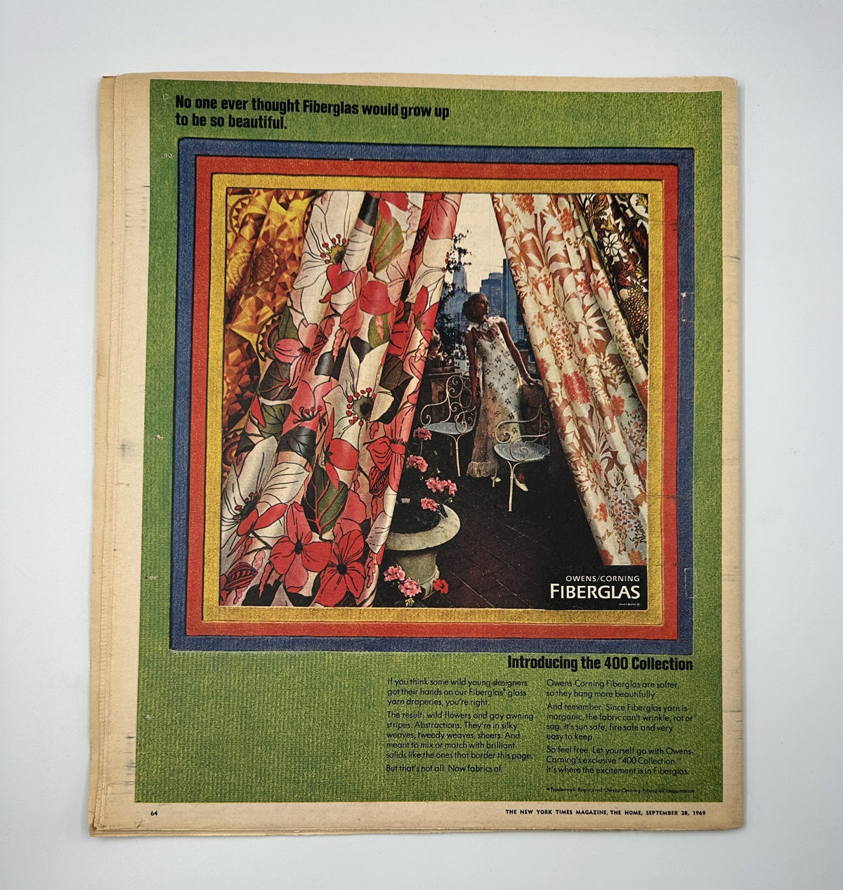 The New York Times Magazine September 28, 1969 showcases an advertisement for Fiberglas curtains in vibrant floral patterns, emphasizing innovative design and style in home interiors.