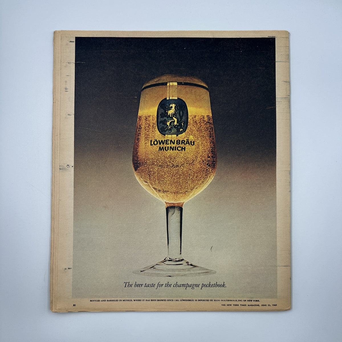 Advertisement page from The New York Times Magazine June 22, 1969 showcasing a Löwenbräu Munich beer glass, highlighting product branding with a soft-focus background.