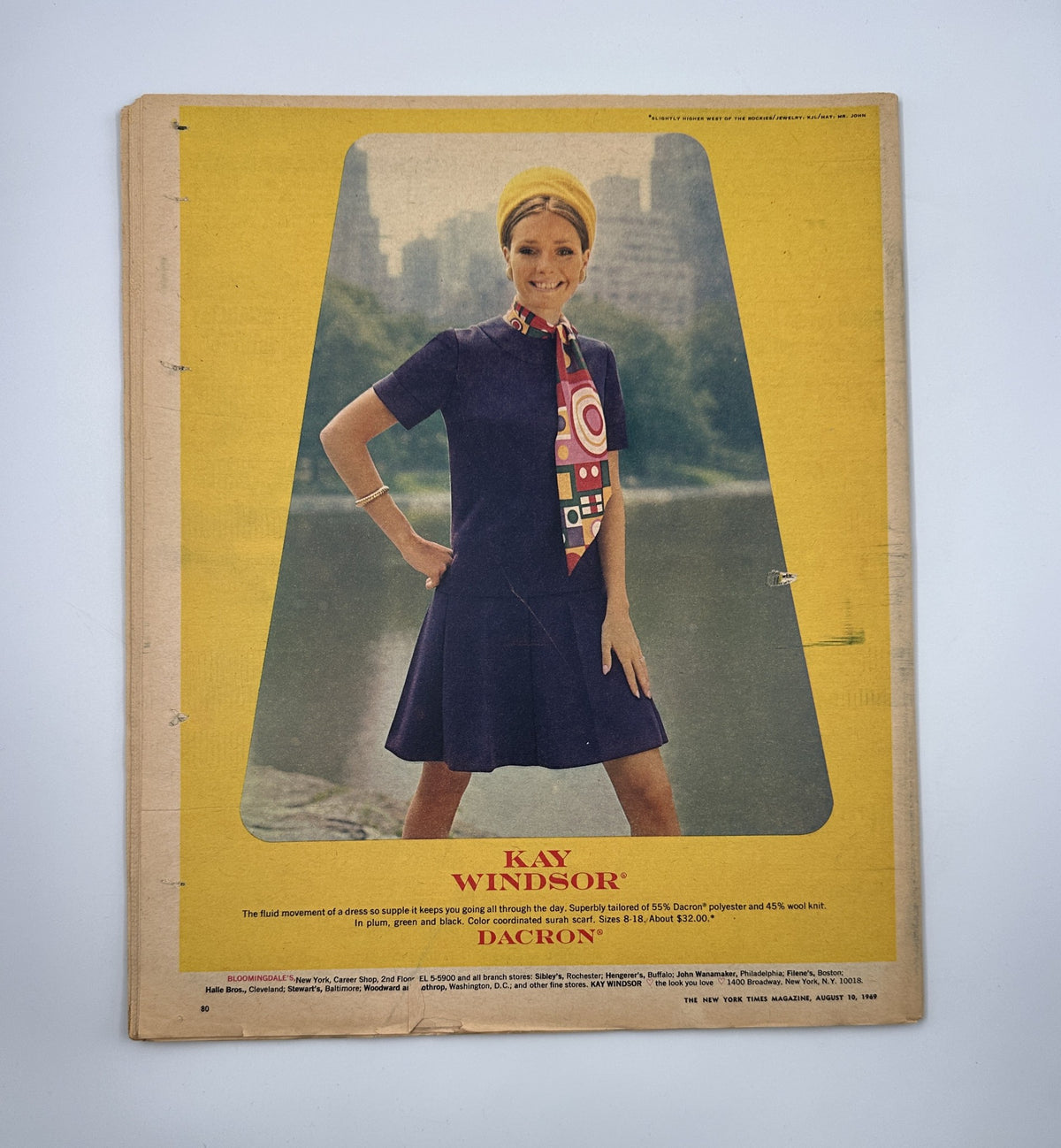 Image from The New York Times Magazine August 10, 1969 displaying an advertisement for Kay Windsor, showcasing a model in a vibrant dress with geometric patterns, set against a park backdrop.