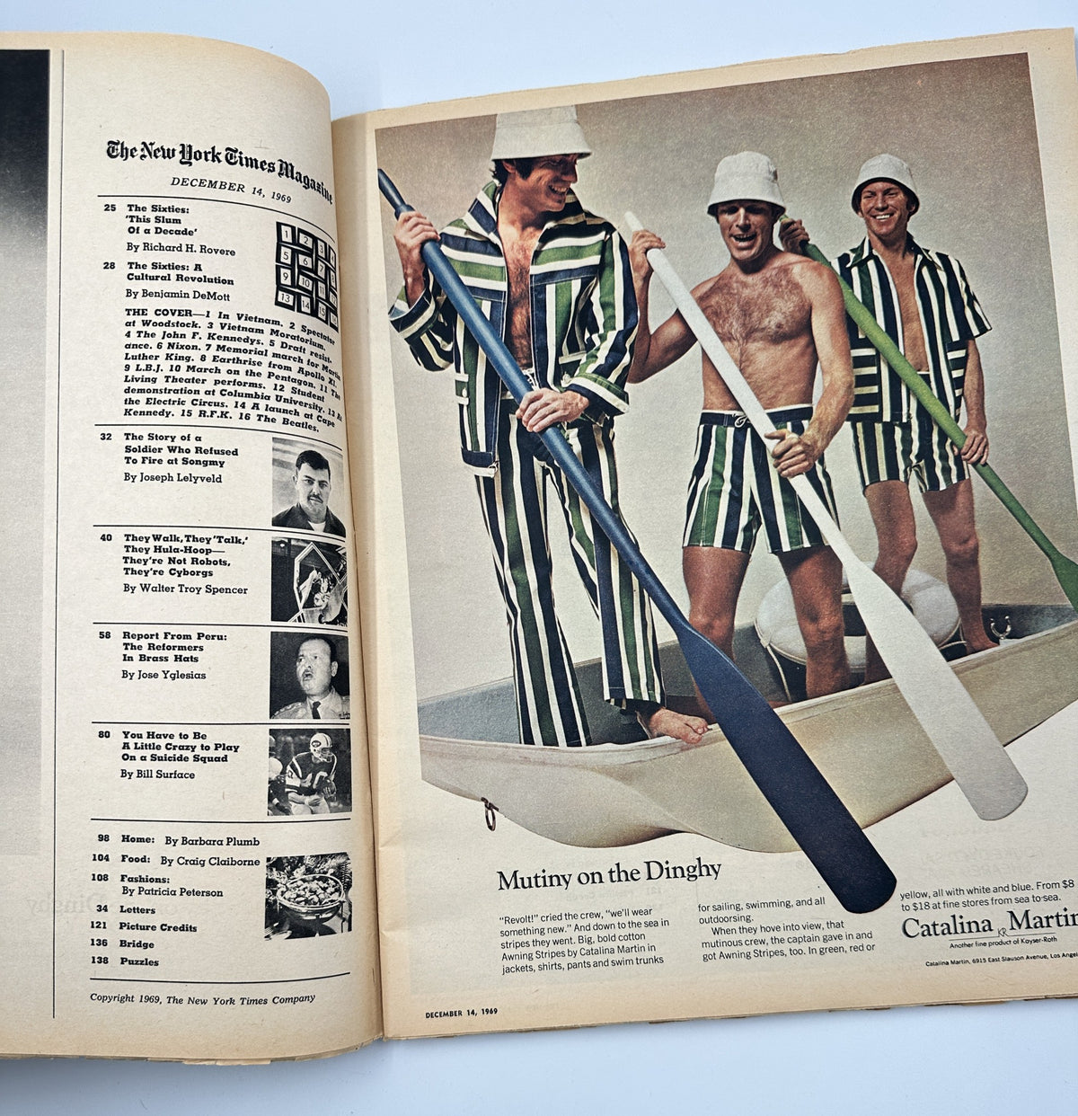 Interior page of The New York Times Magazine December 14, 1969 showcasing a photo feature titled 'Mutiny on the Dingly', featuring three men in matching striped outfits in a humorous boat scene.