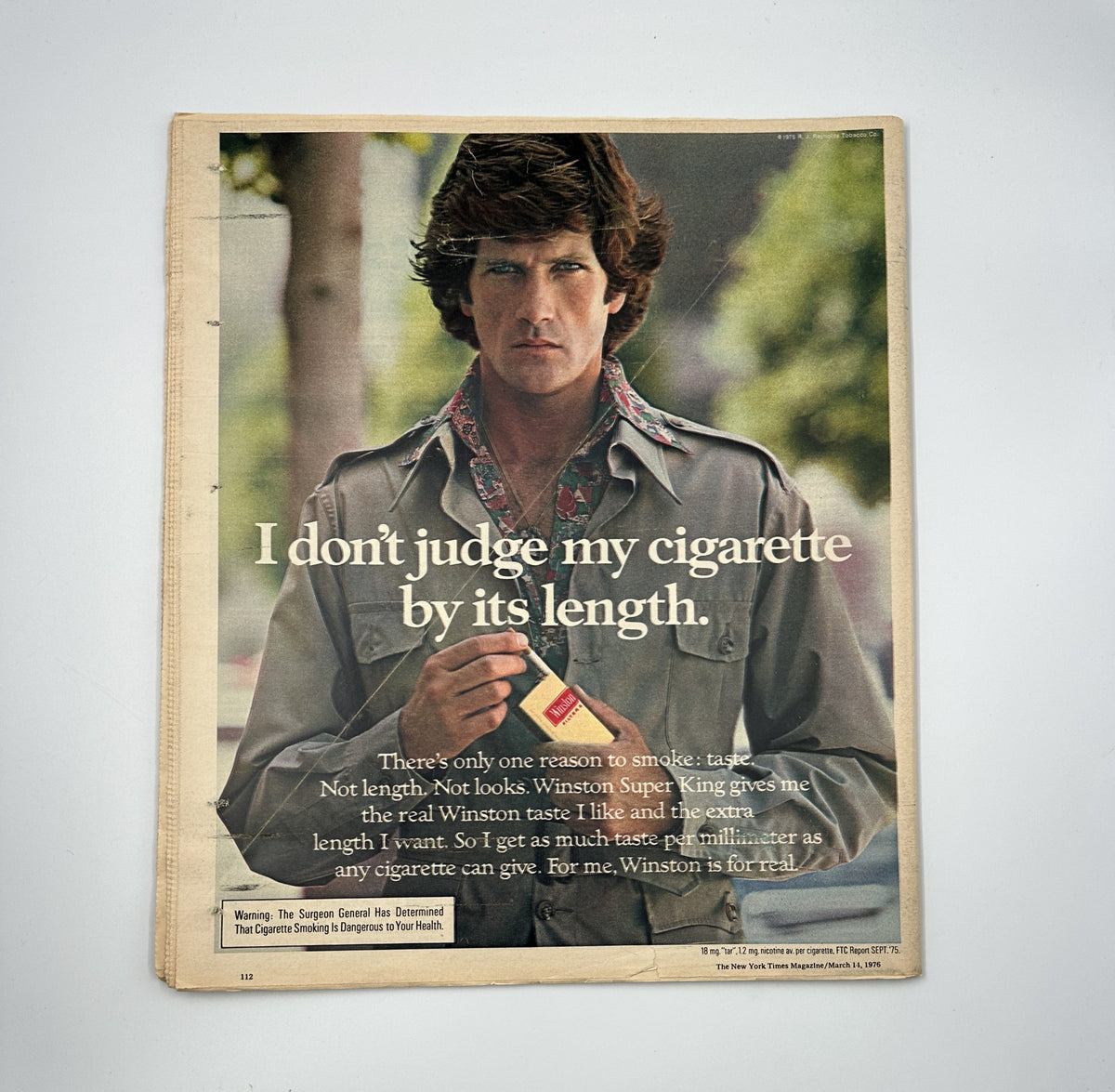 Back cover of The New York Times Magazine from March 14, 1976, featuring an advertisement for Winston cigarettes with the text 'I don't judge my cigarette by its length.'