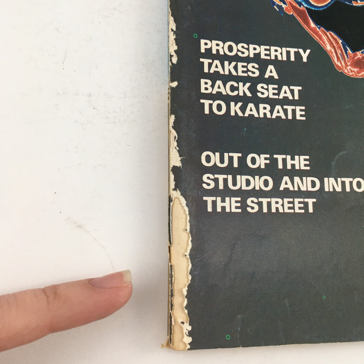 Side view of damaged cover from Karate Illustrated Magazine September 1975 Vol 6 #9 highlighting the aging condition.