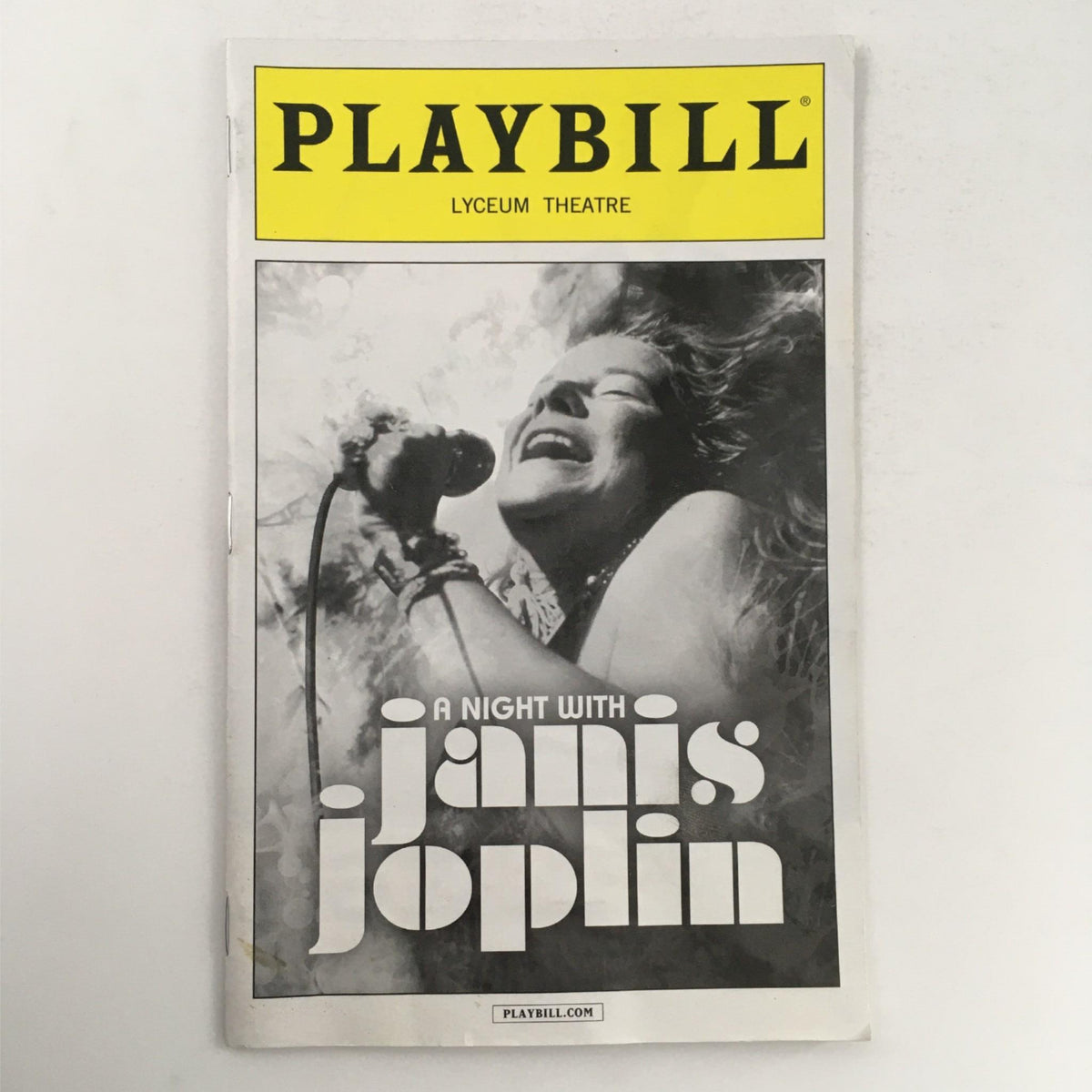 Cover of the 2013 Playbill for 'A Night with Janis Joplin' at Lyceum Theatre, featuring a dramatic black and white photo of Janis Joplin singing passionately.