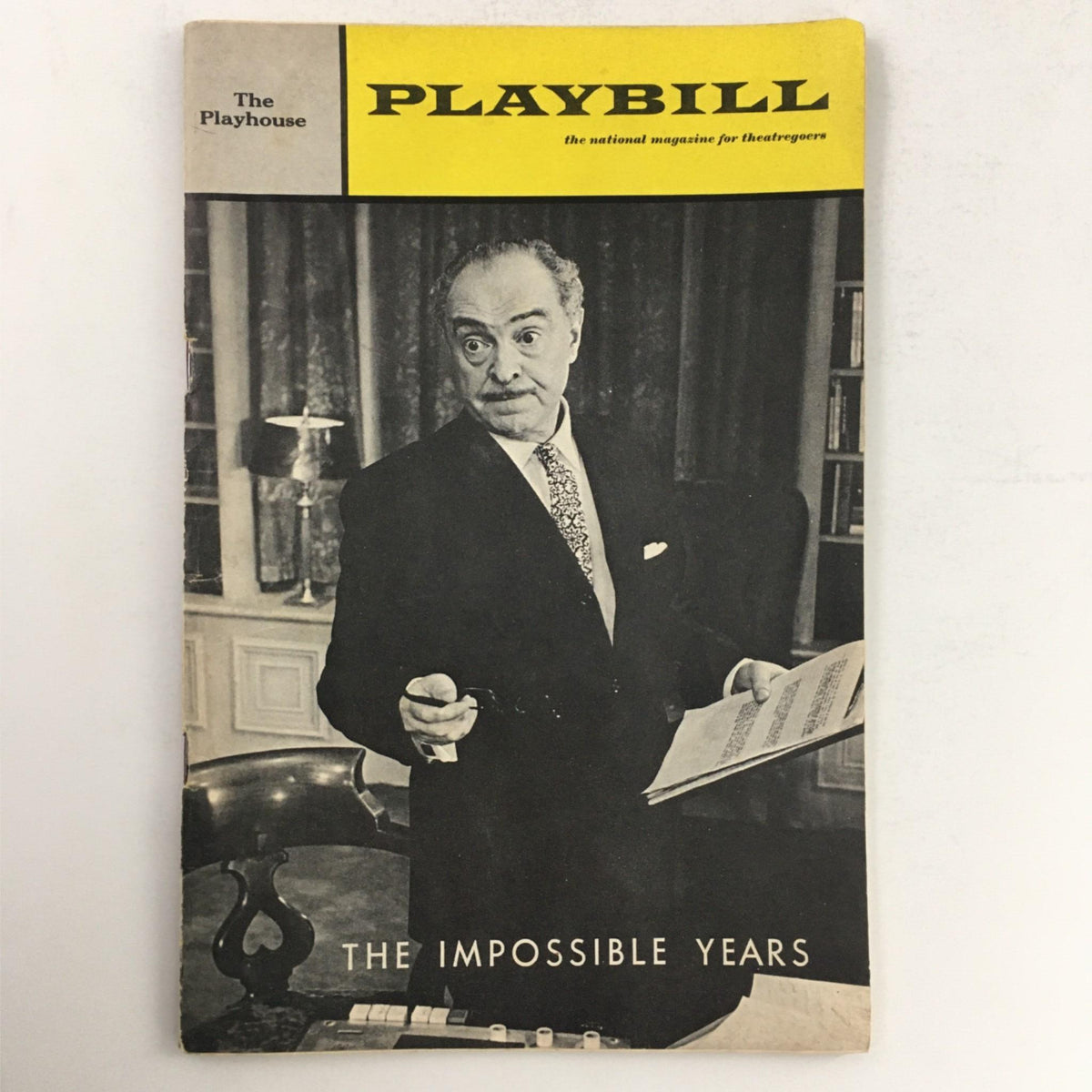 1967 Playbill for The Impossible Years featuring a man in formal attire, showcasing theatrical history at The Playhouse.