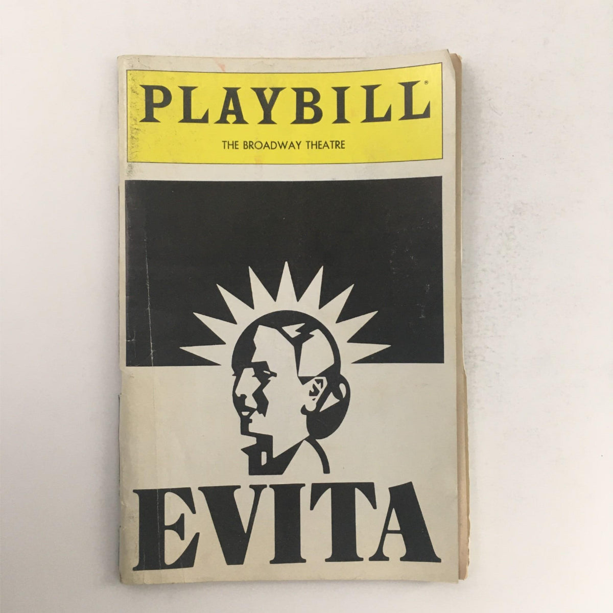 1982 Playbill for Evita by Robert Stigwood, Harold Prince at Broadway Theatre, featuring a striking cover design in black and yellow.