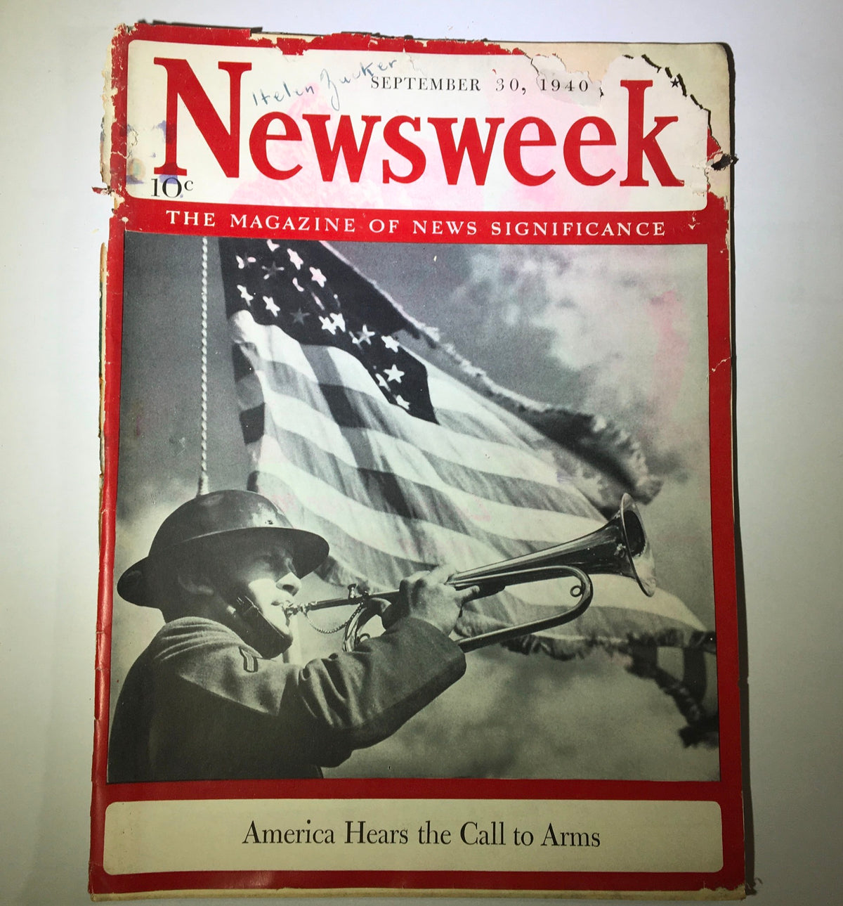 Cover of Newsweek Magazine September 30, 1940, featuring a soldier playing a trumpet with an American flag in the background. The headline reads 'America Hears the Calls to Arms,' capturing a historical moment as the nation prepared for World War II.
