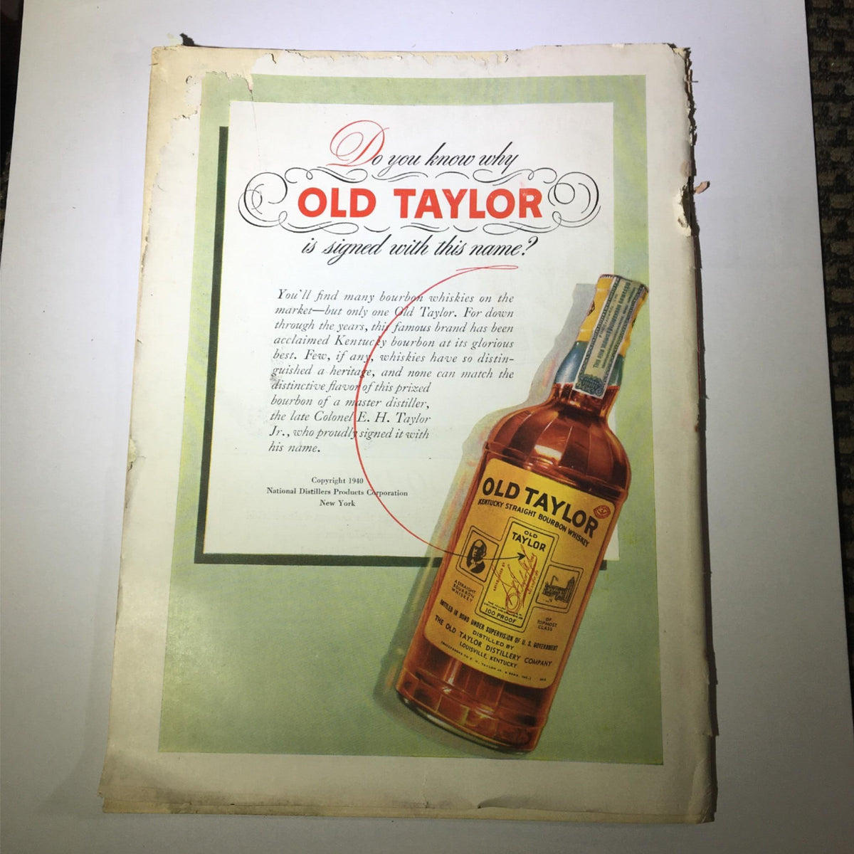 Advertisement page from a vintage publication, featuring Old Taylor Bourbon, giving insight into the marketing and product promotion of the era.