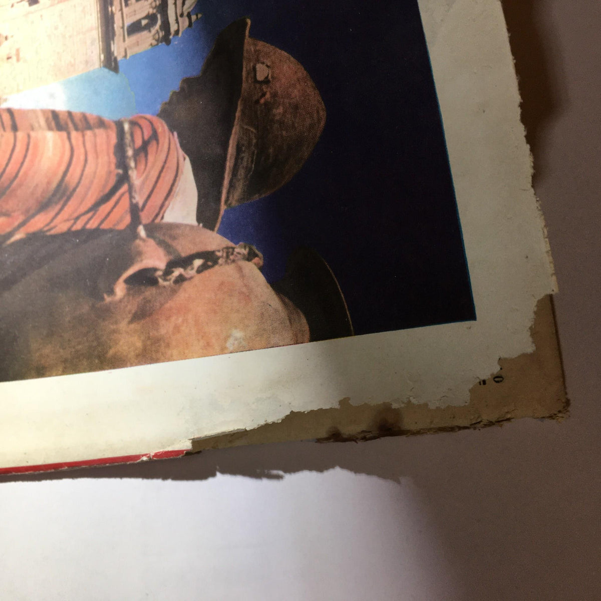 Close-up view of the corner of the Newsweek Magazine July 22, 1940, highlighting the magazine's age with visible wear and tear, indicative of its vintage status.