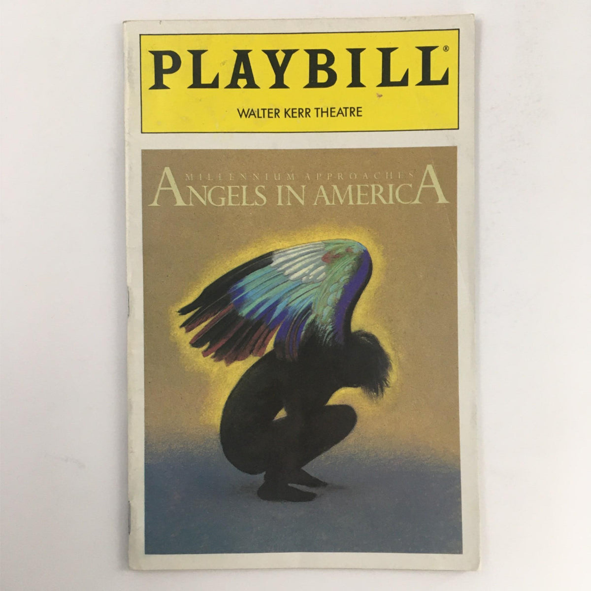 1993 Playbill Angels in America by Tony Kushner at Walter Kerr Theatre featuring an artistic cover illustration of a figure kneeling with colorful angel wings.