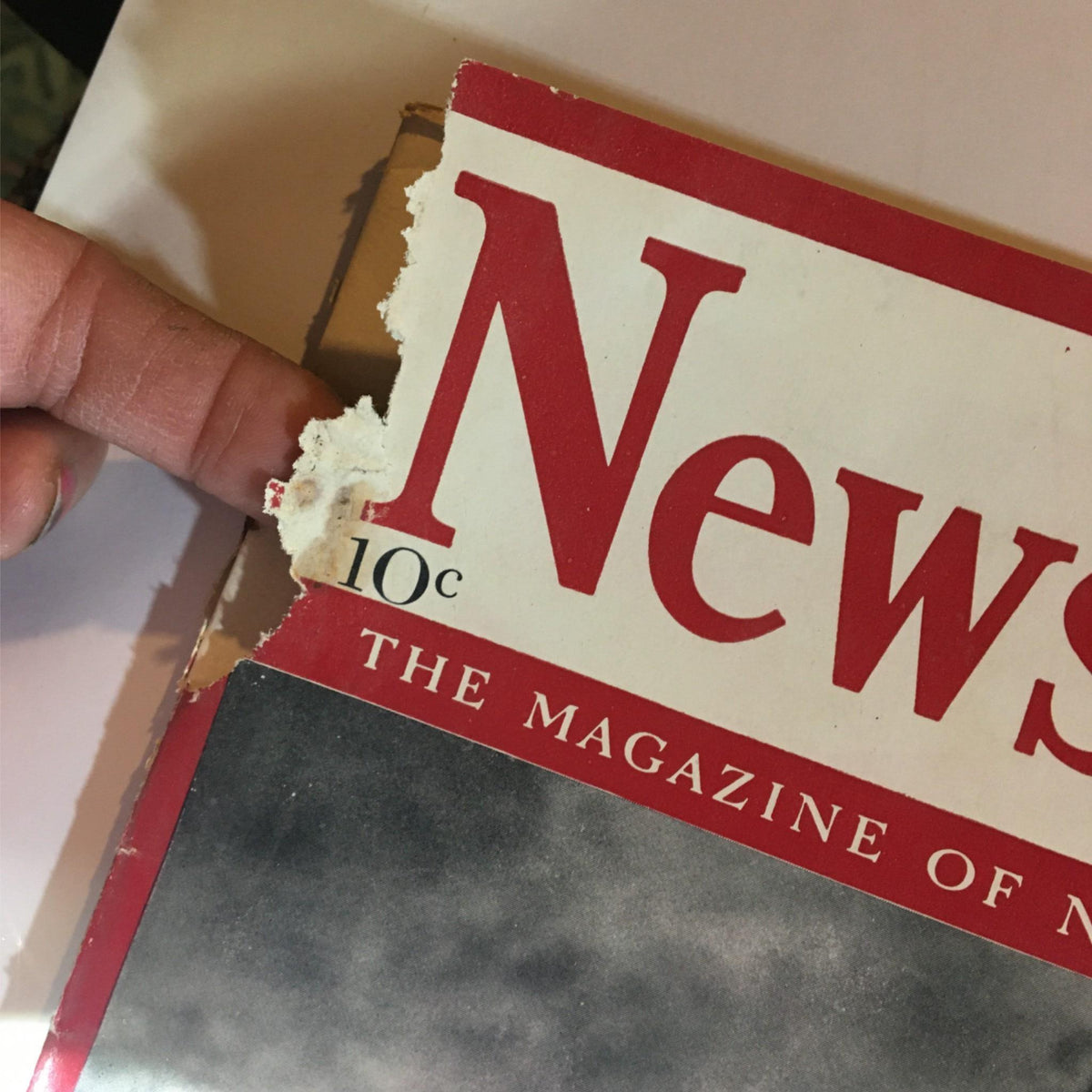 Wear and tear on the top corner of the Newsweek Magazine cover dated July 15, 1940, revealing vintage details.