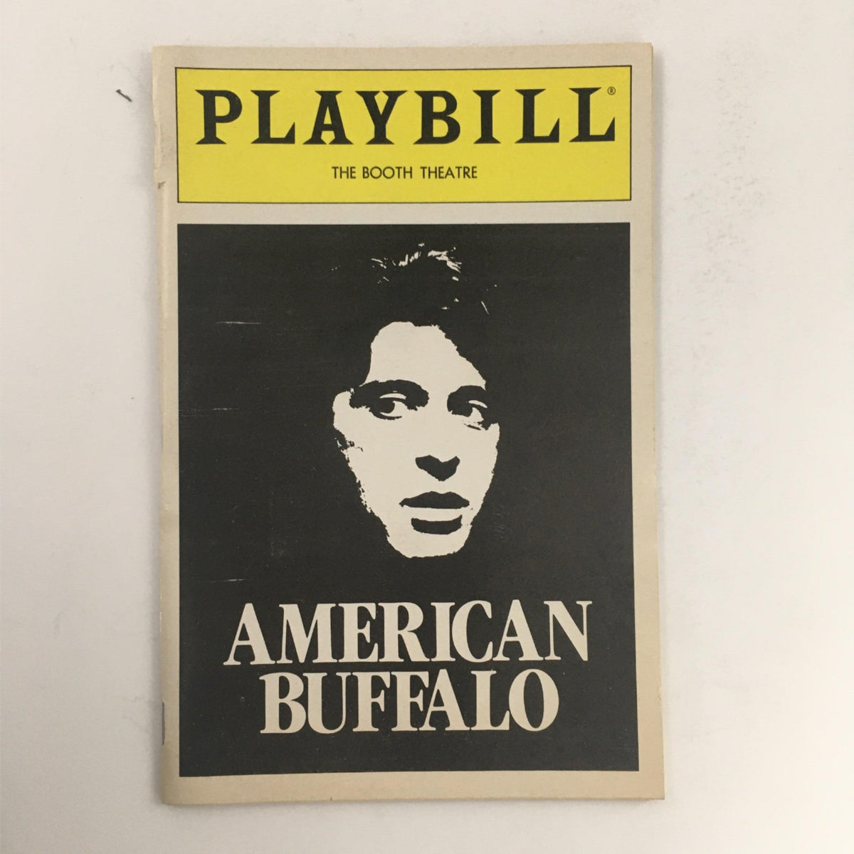 1984 Playbill for 'American Buffalo' by David Mamet featuring Al Pacino at The Booth Theatre, showcasing a vintage design with prominent title and actor's portrait.
