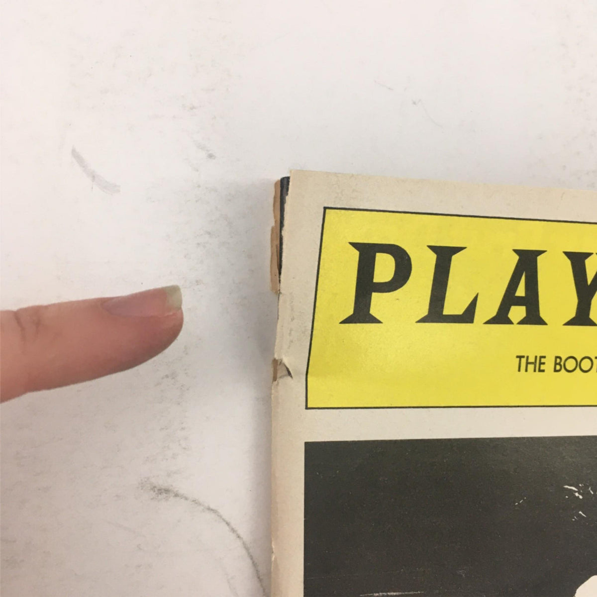 Close-up of the 1984 Playbill for 'American Buffalo' by David Mamet, showing the distinctive 'PLAYBILL' logo and edge of the magazine.
