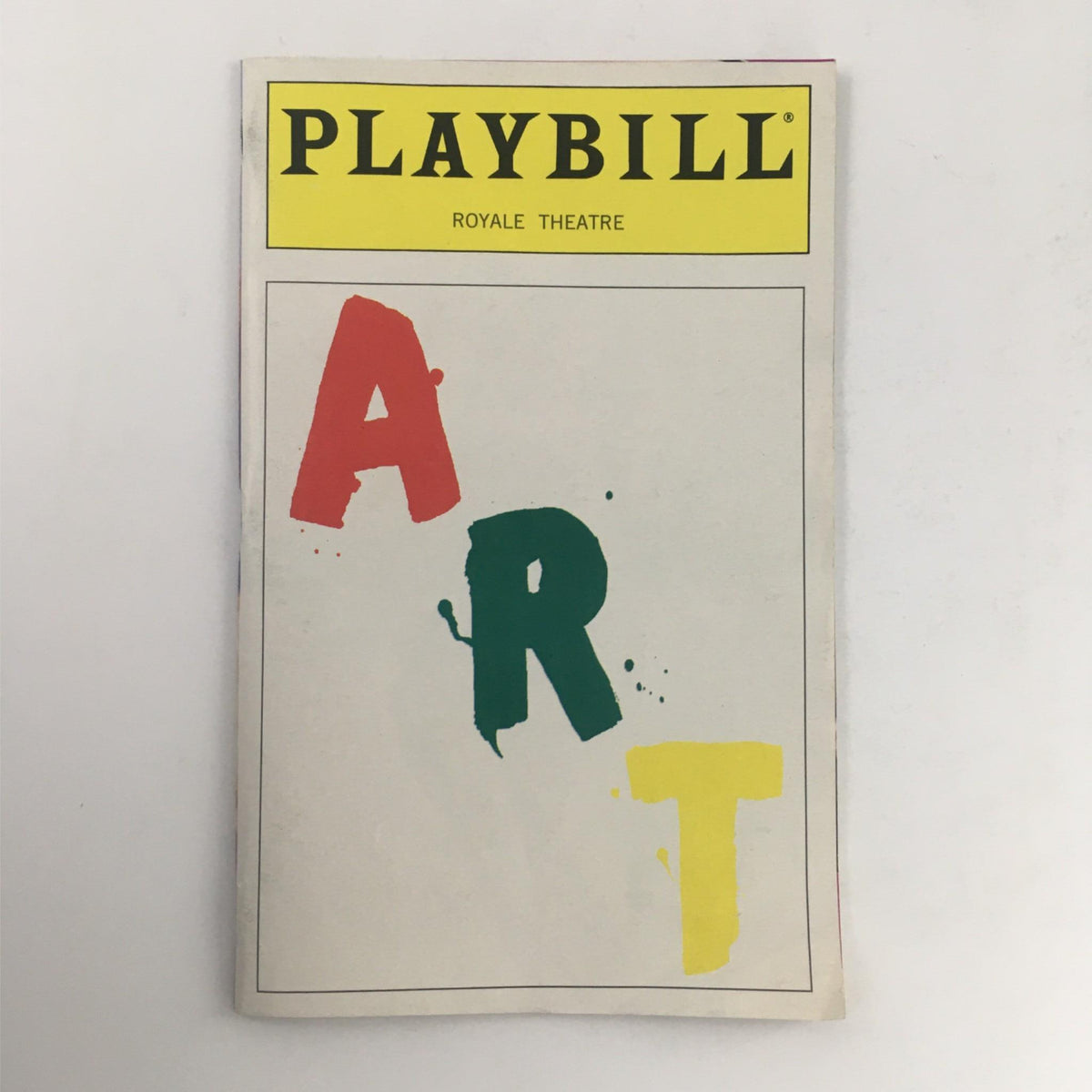 1998 Playbill Art by Yasmina Reza at Royale Theatre featuring bold colored letters on the cover, showcasing theatrical history and artistry.