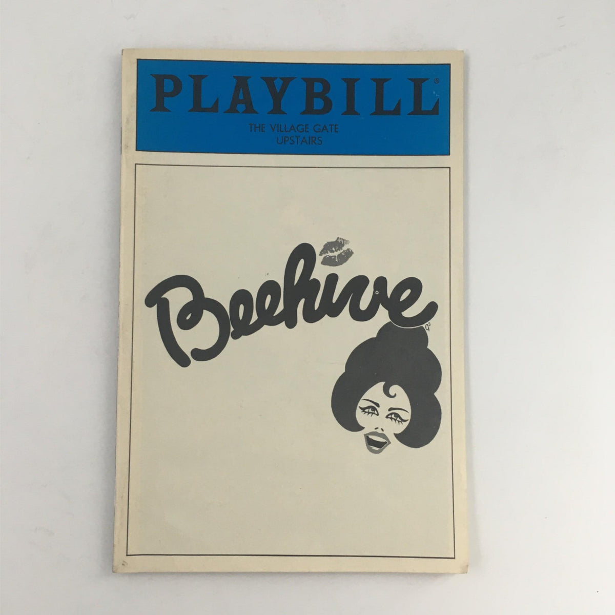 Front cover of the 1986 Playbill for Beehive, featuring bold typography and iconic design from The Village Gate.