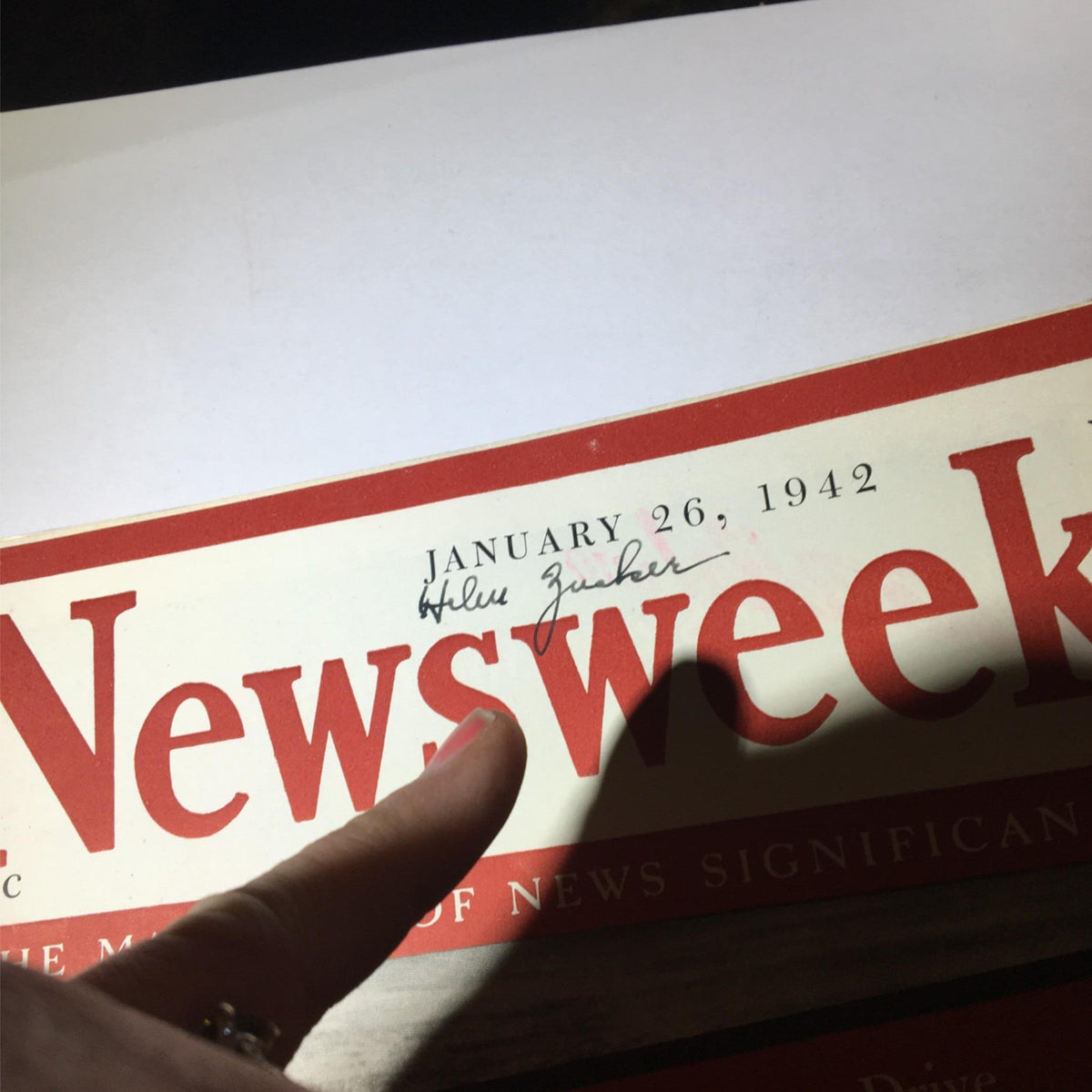 Close-up view of the Newsweek Magazine from January 26, 1942, displaying the publication date and a handwritten name on the cover.