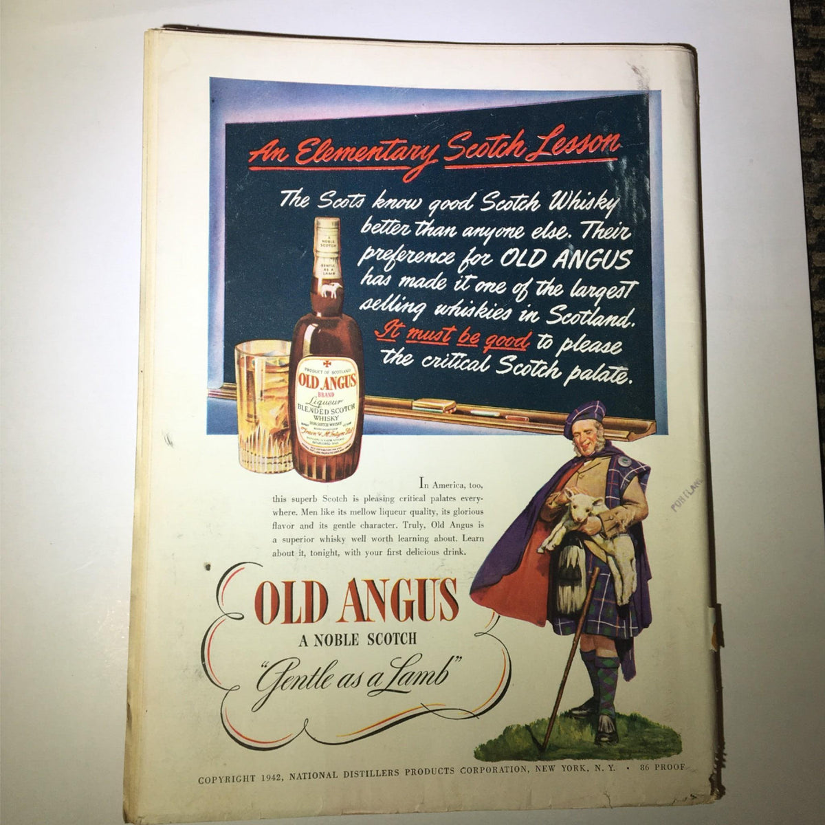 Back cover of the Newsweek Magazine January 26, 1942, featuring an advertisement for Old Angus Scotch whisky with vibrant graphics.