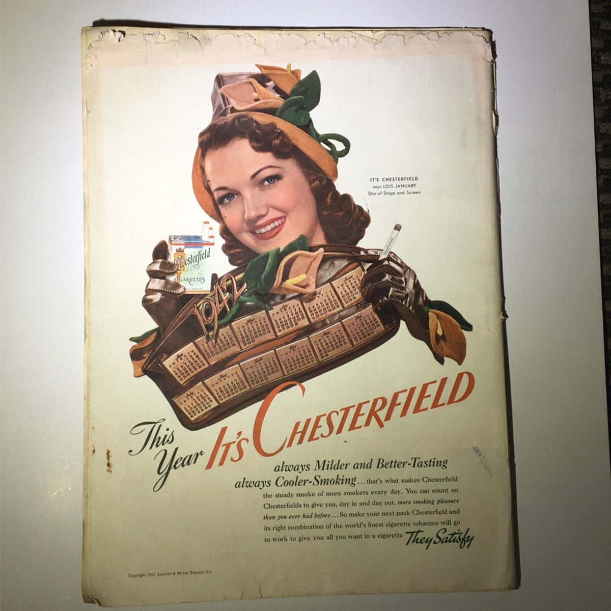 Cover of Newsweek Magazine February 9, 1942 featuring a vintage advertisement for Chesterfield cigarettes, showcasing a woman with curly hair holding a basket of calendars and holding a cigarette.