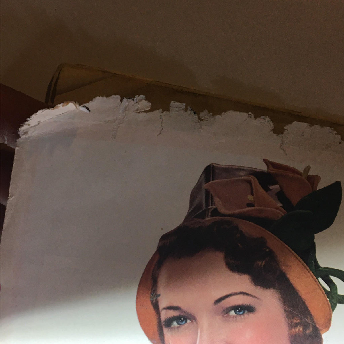 Close-up of the Chesterfield cigarette advertisement from the Newsweek Magazine February 9, 1942 issue, highlighting the woman's smile and her hat decorated with flowers.