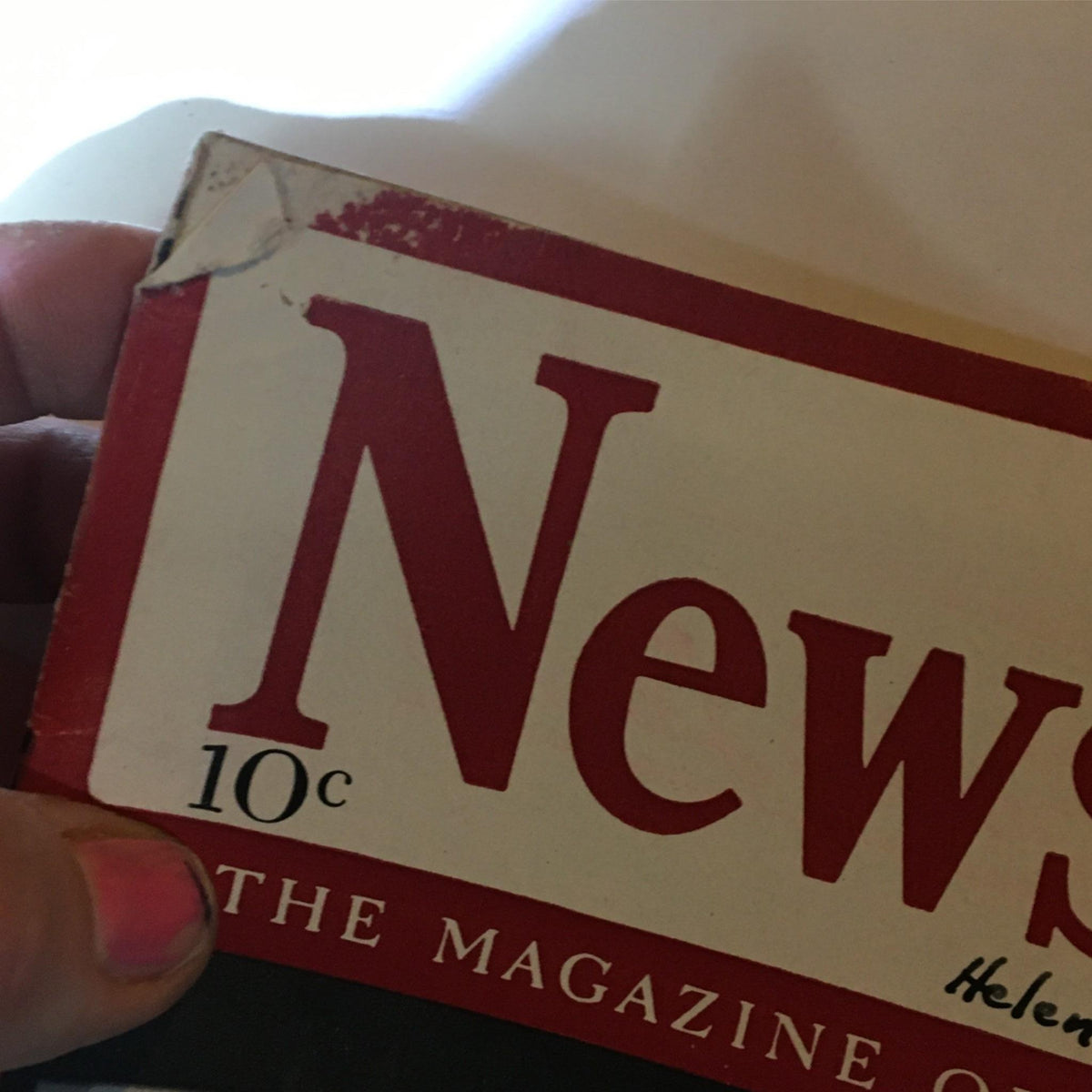 Close-up of the top corner of the Newsweek Magazine from February 2, 1942, showing the title and publisher information, with visible wear and vintage appeal.