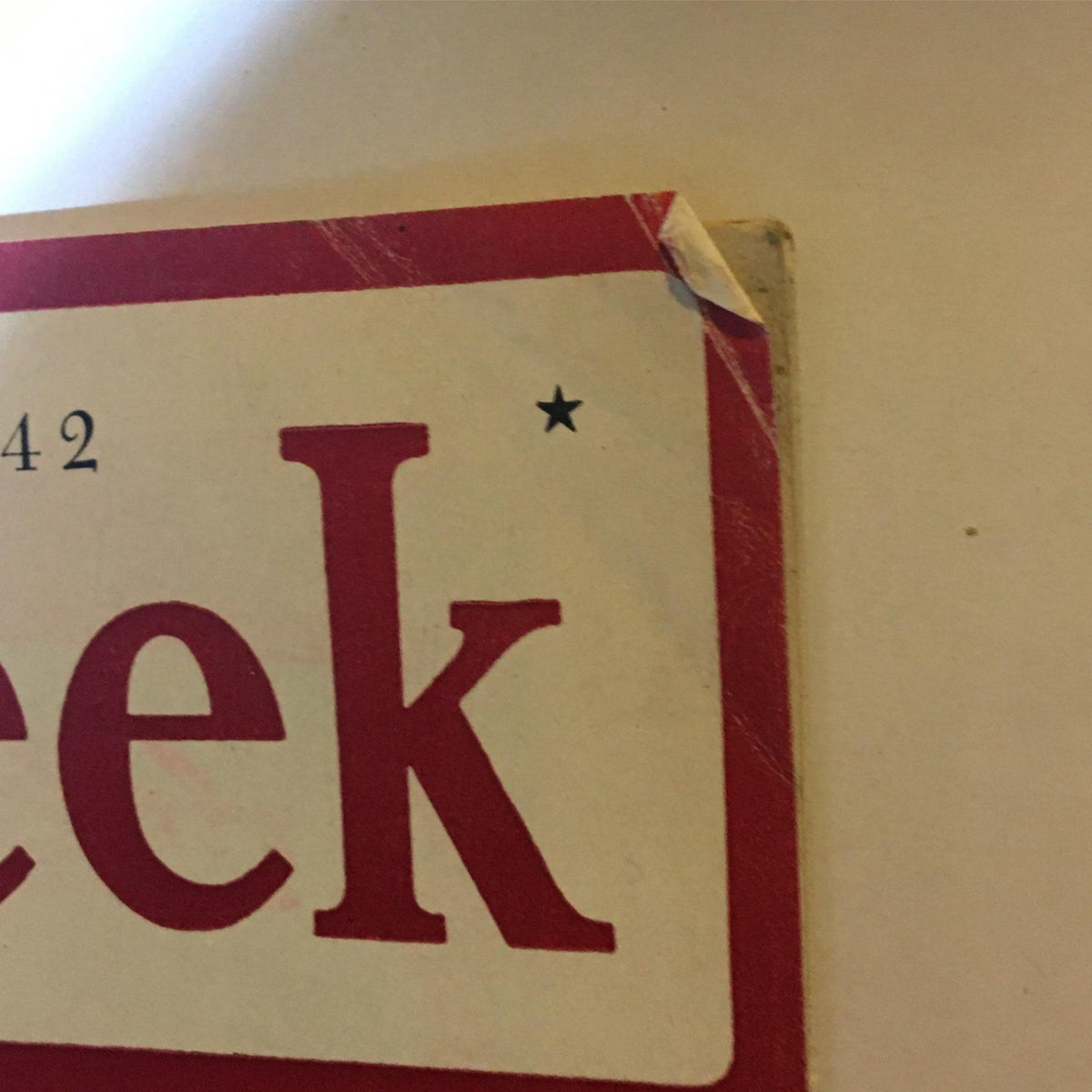 Close-up of the top corner of the Newsweek Magazine February 2, 1942, highlighting the title and date with noticeable wear and tear.