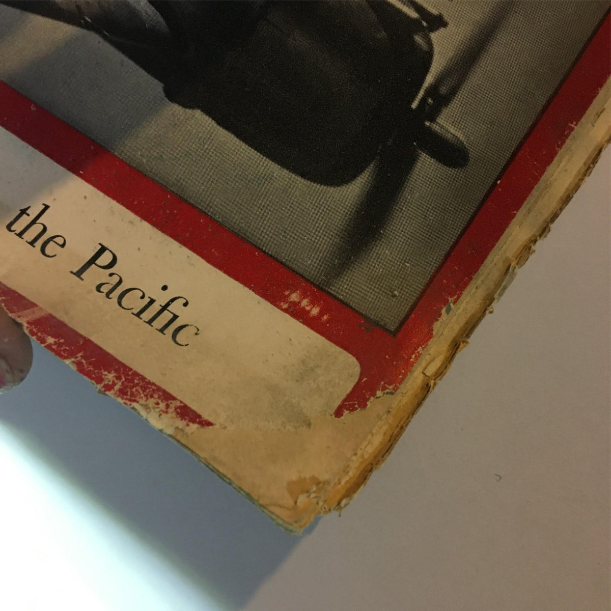 Detailed view of the edge of the Newsweek Magazine, January 5, 1942, illustrating signs of wear and age, emphasizing its collectible nature.