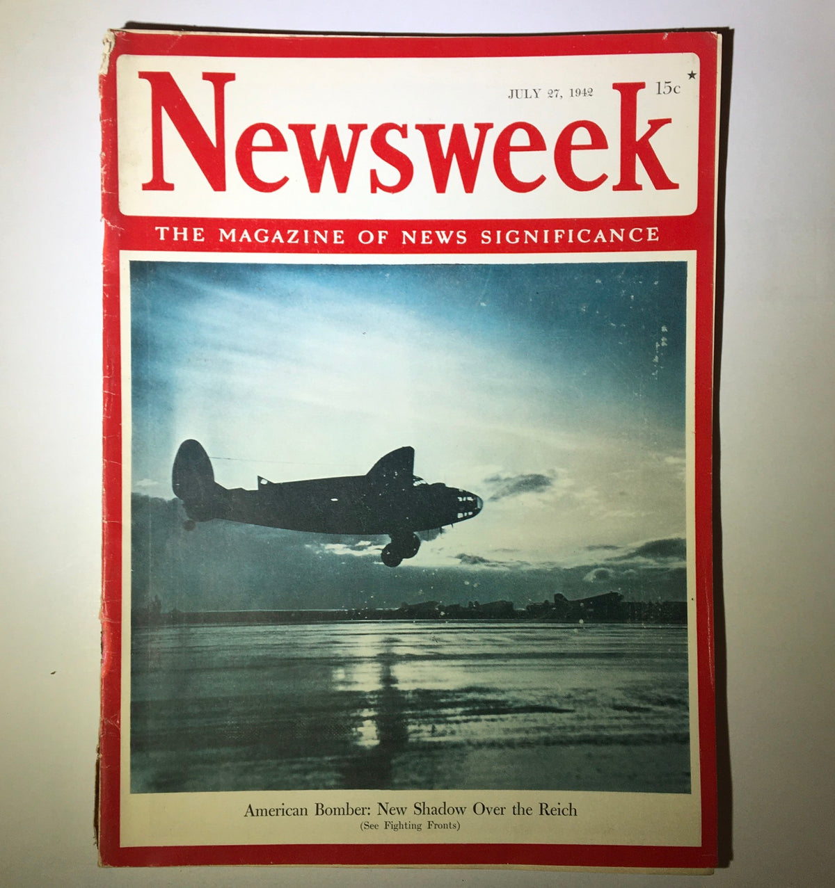 Cover of Newsweek Magazine from July 27, 1942, featuring American Bomber: New Shadow Over the Reich, showcasing a silhouette of an aircraft against a cloudy sky.