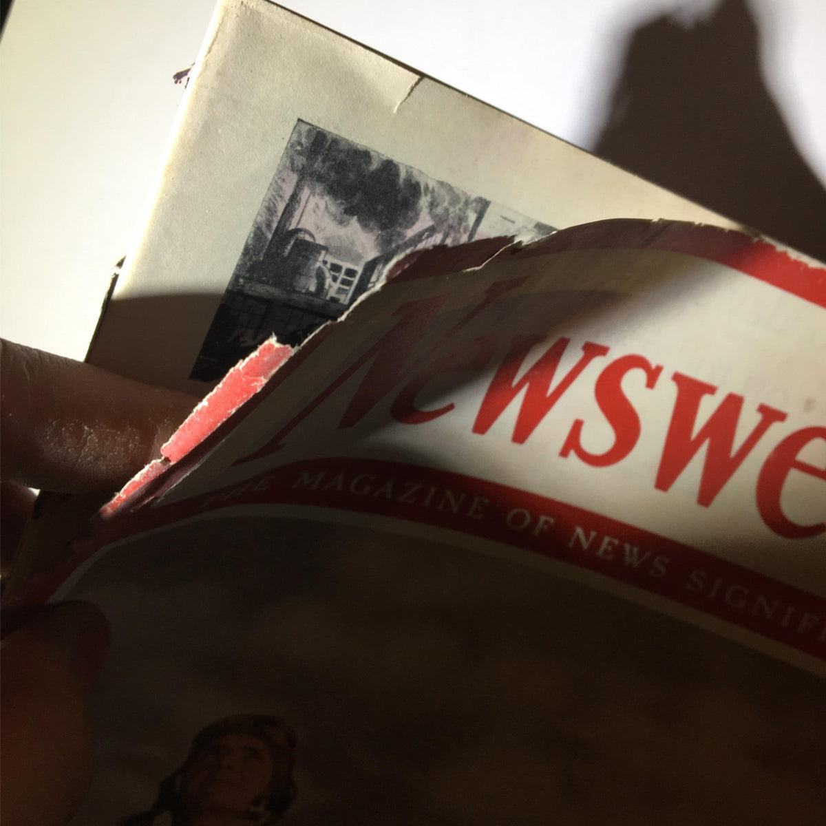 Close-up view of Newsweek Magazine June 15, 1942, showing wear and tear on the cover as it features the title 'Yank Airmen Pearl Harbor Score Was Partly Evened'.