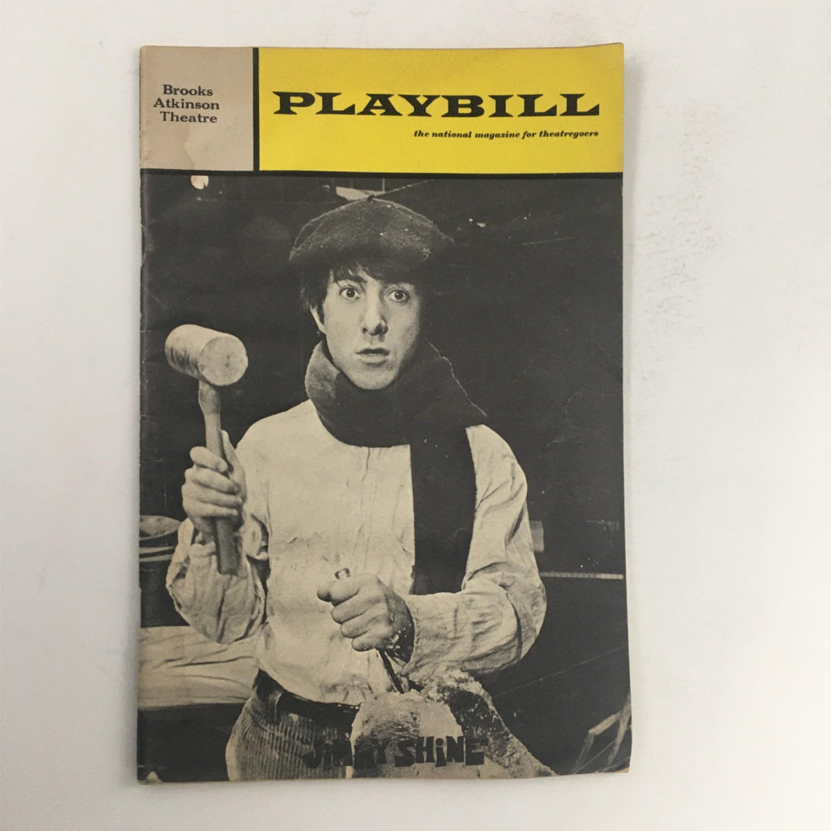 1969 Playbill for Jimmy Shine by Murray Schisgal featuring Dustin Hoffman, showcased at Brooks Atkinson Theatre, depicting a black and white image of a man in costume holding a hammer.