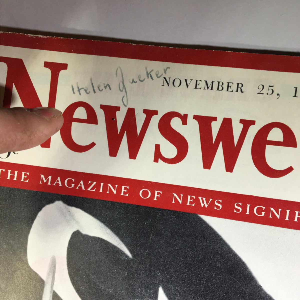 Close-up of the Newsweek Magazine cover dated November 25, 1940 showing the title and a handwritten name 'Helen Gueker'.