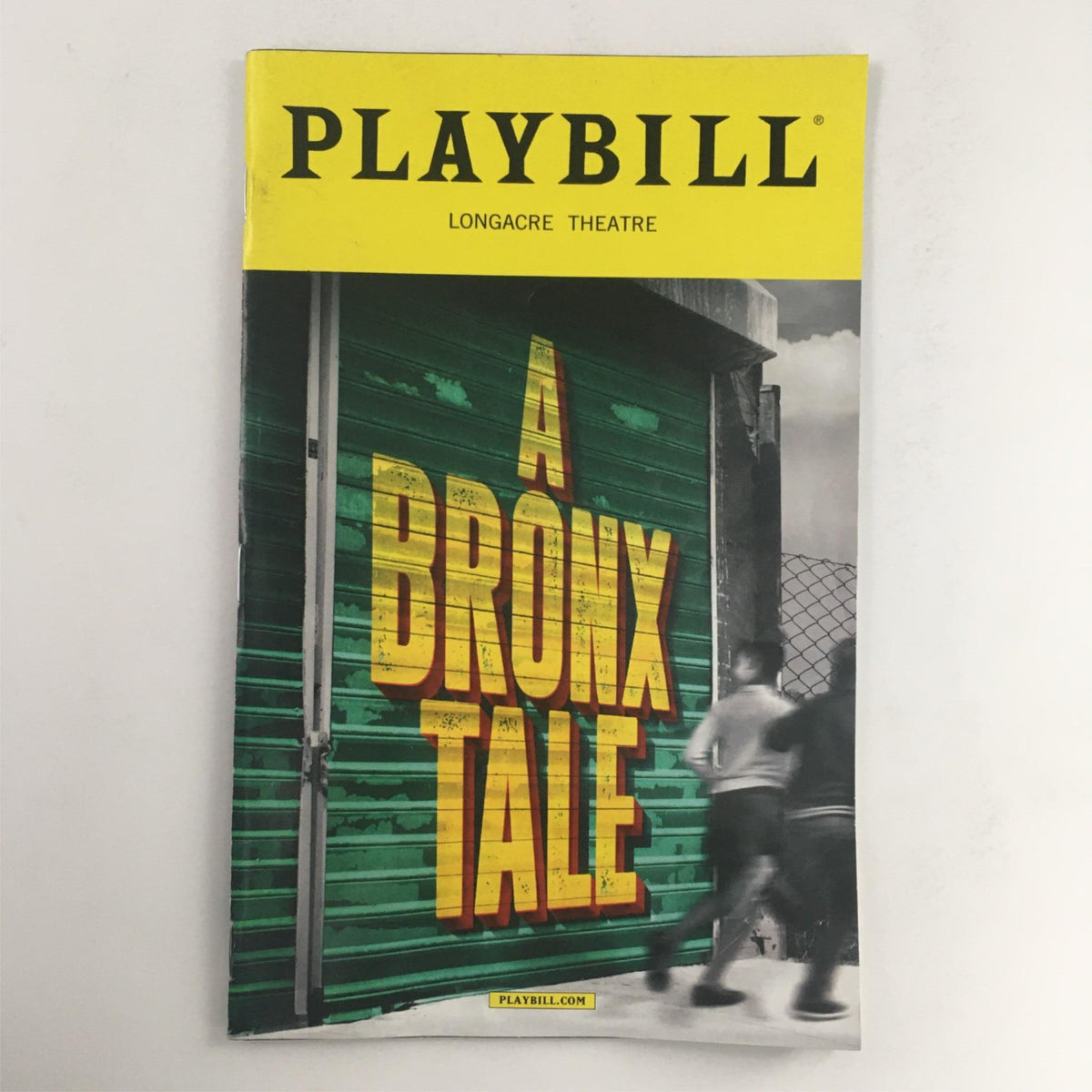2017 Playbill for A Bronx Tale at Longacre Theatre, featuring vibrant cover design and striking title on a green backdrop.