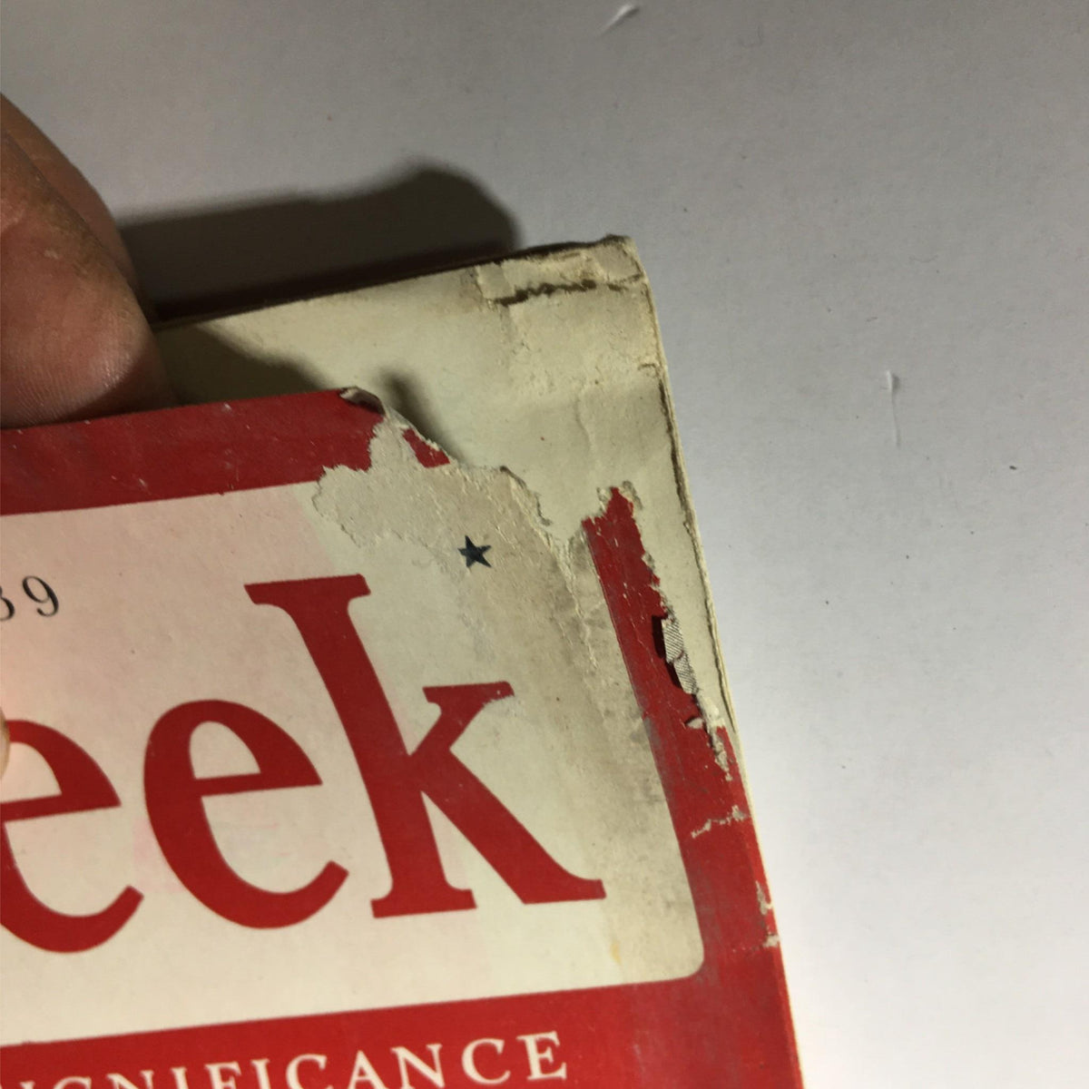 Close-up image of the damaged corner of Newsweek Magazine July 17, 1939, illustrating wear and signs of aging on the cover.
