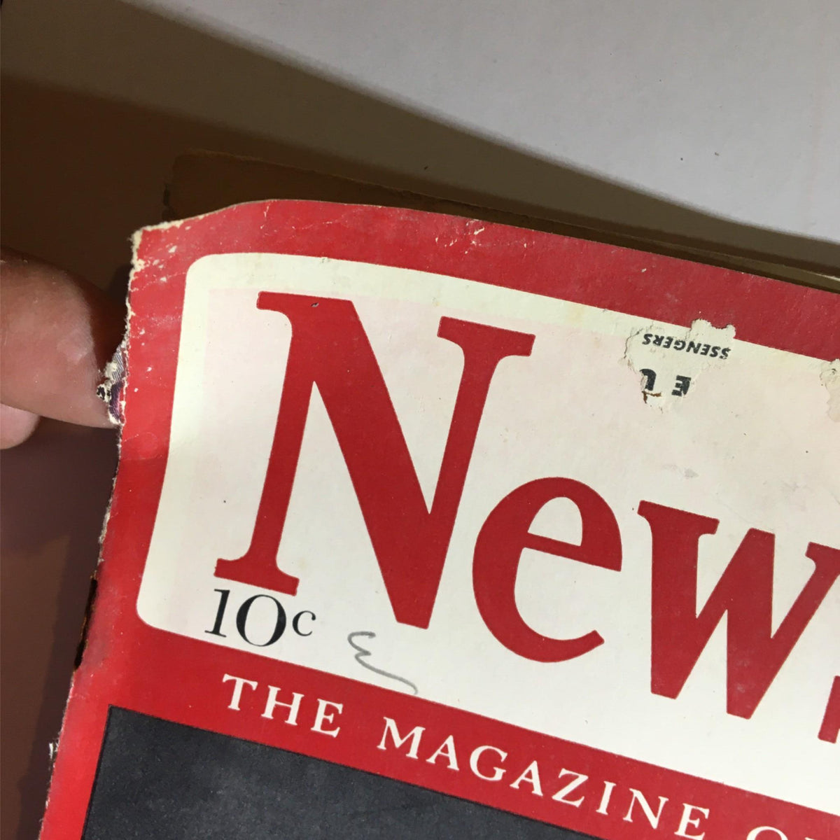 Close-up of the cover of Newsweek Magazine July 17, 1939 featuring vintage design elements, including the title and price, along with signs of wear and aging.