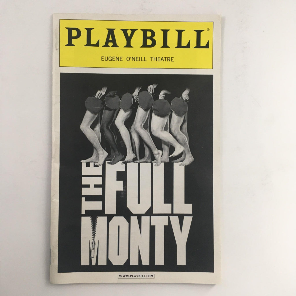 2002 Playbill for The Full Monty, a Broadway Musical directed by Jack O'Brien, showcasing the iconic cover design featuring stylized legs and the show's title in bold letters.