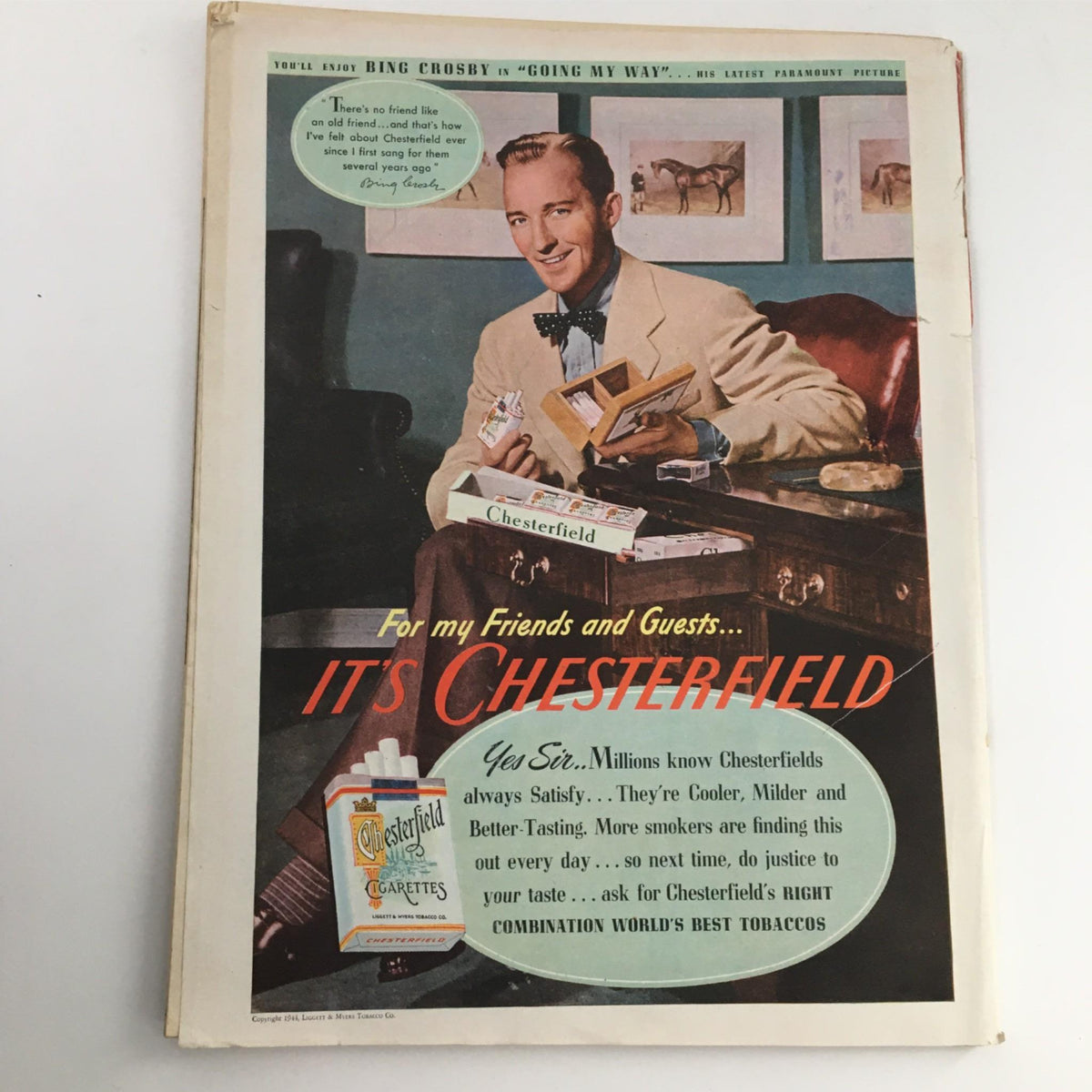 Advertisment page featuring Bing Crosby promoting Chesterfield cigarettes in the Newsweek Magazine from September 18, 1944, capturing mid-20th century advertising style.
