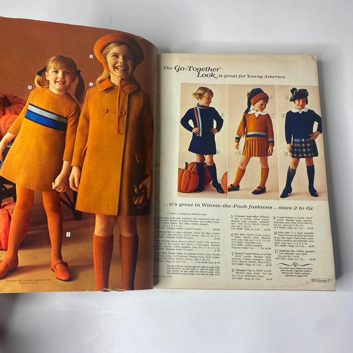 Inside page of the 1967 Sears Fall and Winter Catalog displaying children’s fashion with girls in colorful dresses and fall attire.