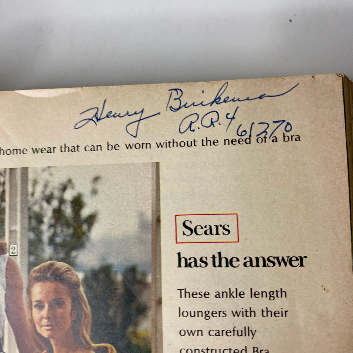 Close-up of the 1969 Sears Spring Through Summer Catalog showing an inner page detail with handwritten notes and vintage homewear clothing description.
