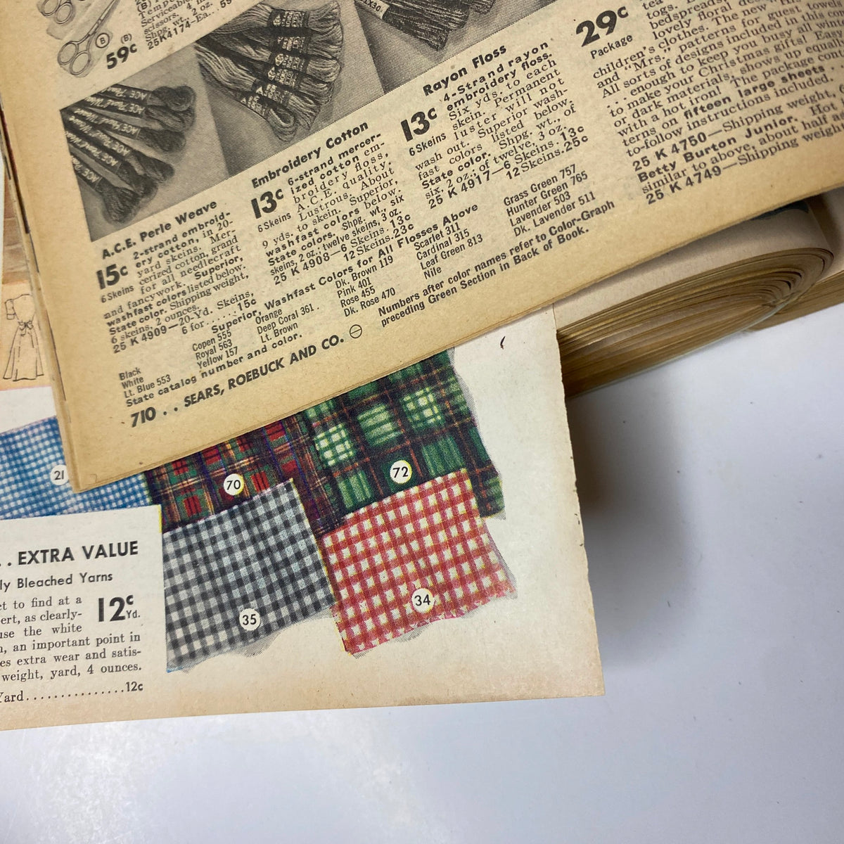 1941 - 1942 Sears Fall and Winter Catalog featuring detailed fabric swatches and clothing items, highlighting choices for sewing and home fashion in the early 1940s.