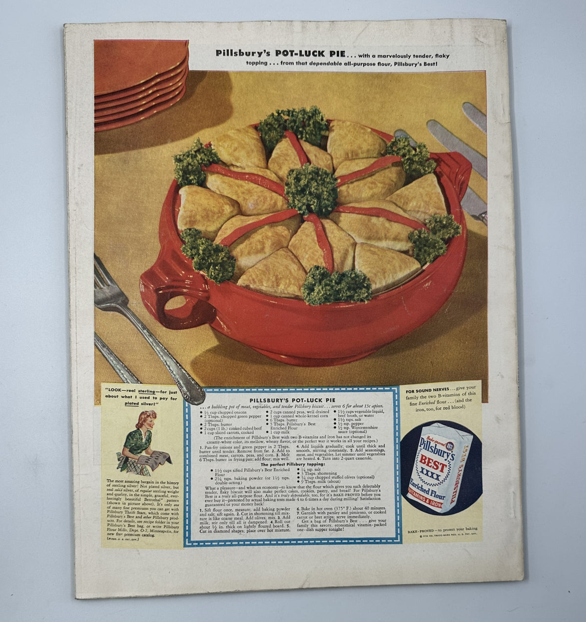 Back cover of Woman’s Home Companion Magazine October 1942 displaying an advertisement for Pillsbury’s Pot-Luck Pie, featuring a vibrant red pie pan and enticing recipe text.
