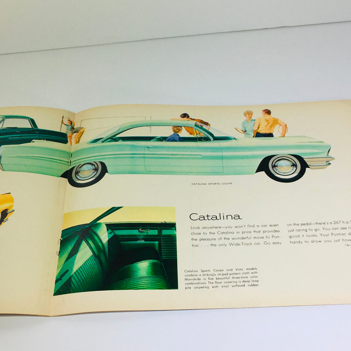 1951 Pontiac Catalina Sports Coupe brochure showcasing the sleek design and sporty features of the car with colorful illustrations and people enjoying the ride.