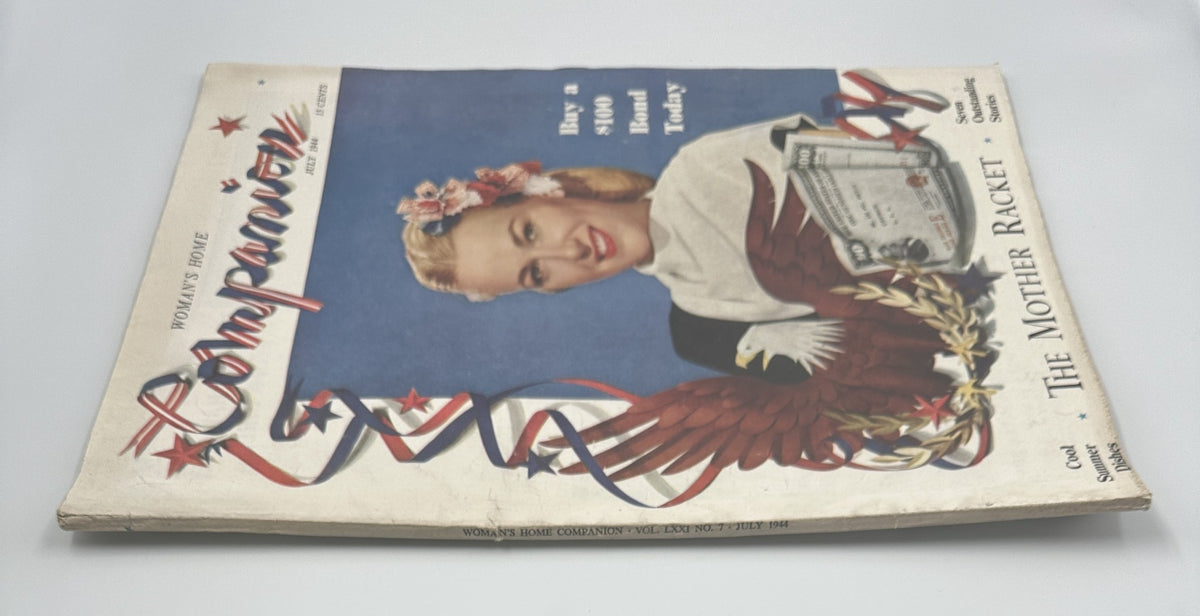 Side view of Woman’s Home Companion Magazine July 1944 with Bette Jane Hess on the cover, showcasing the vintage design and promotional content.