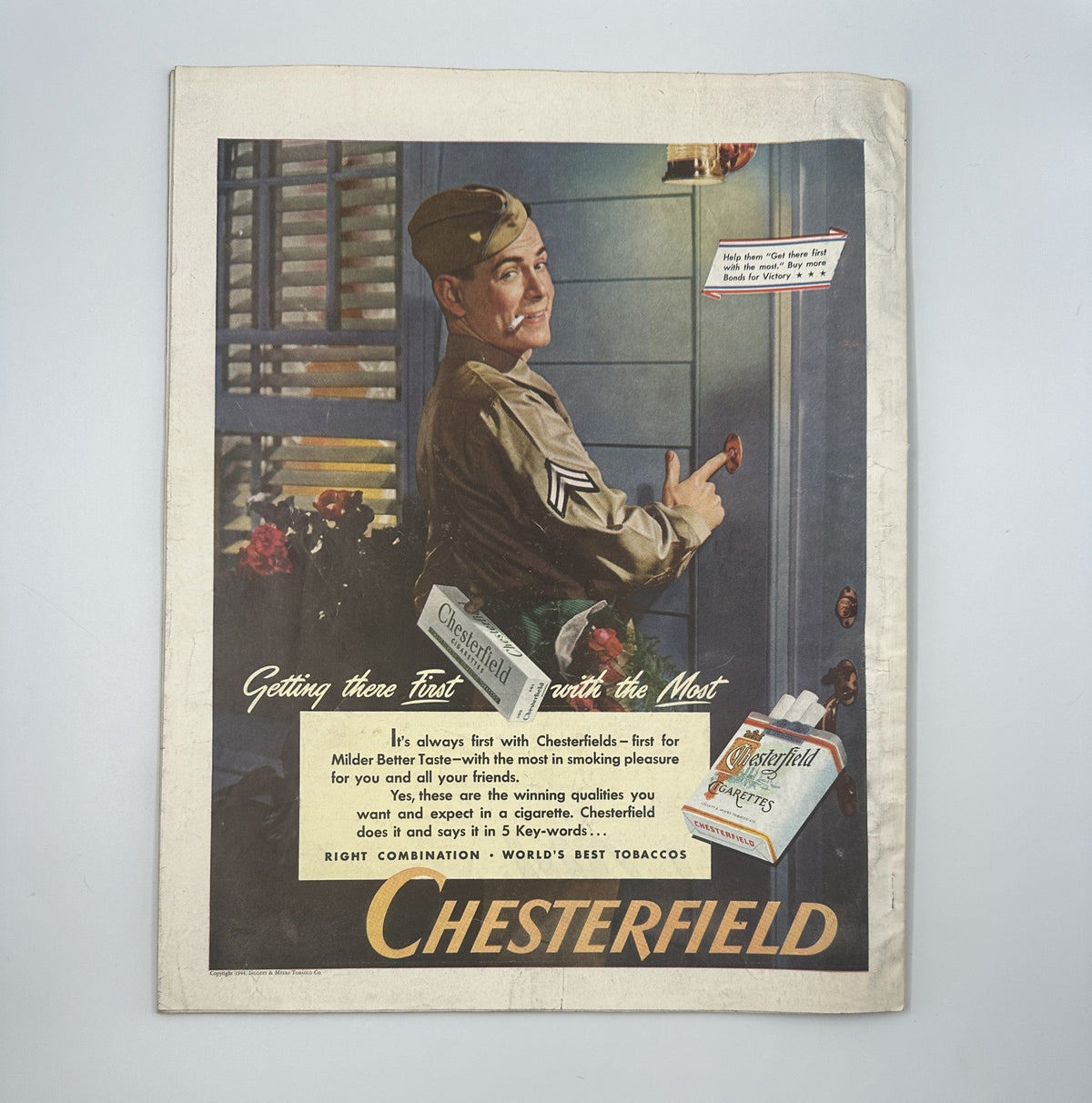 Advertisement from Woman’s Home Companion Magazine July 1944 featuring a soldier promoting Chesterfield cigarettes, adding a historical context to the magazine.