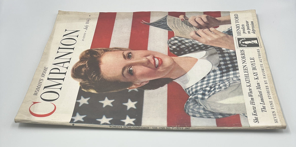 Woman’s Home Companion Magazine July 1943 featuring an American Flag cover with a smiling woman in a dress, highlighting patriotic themes.
