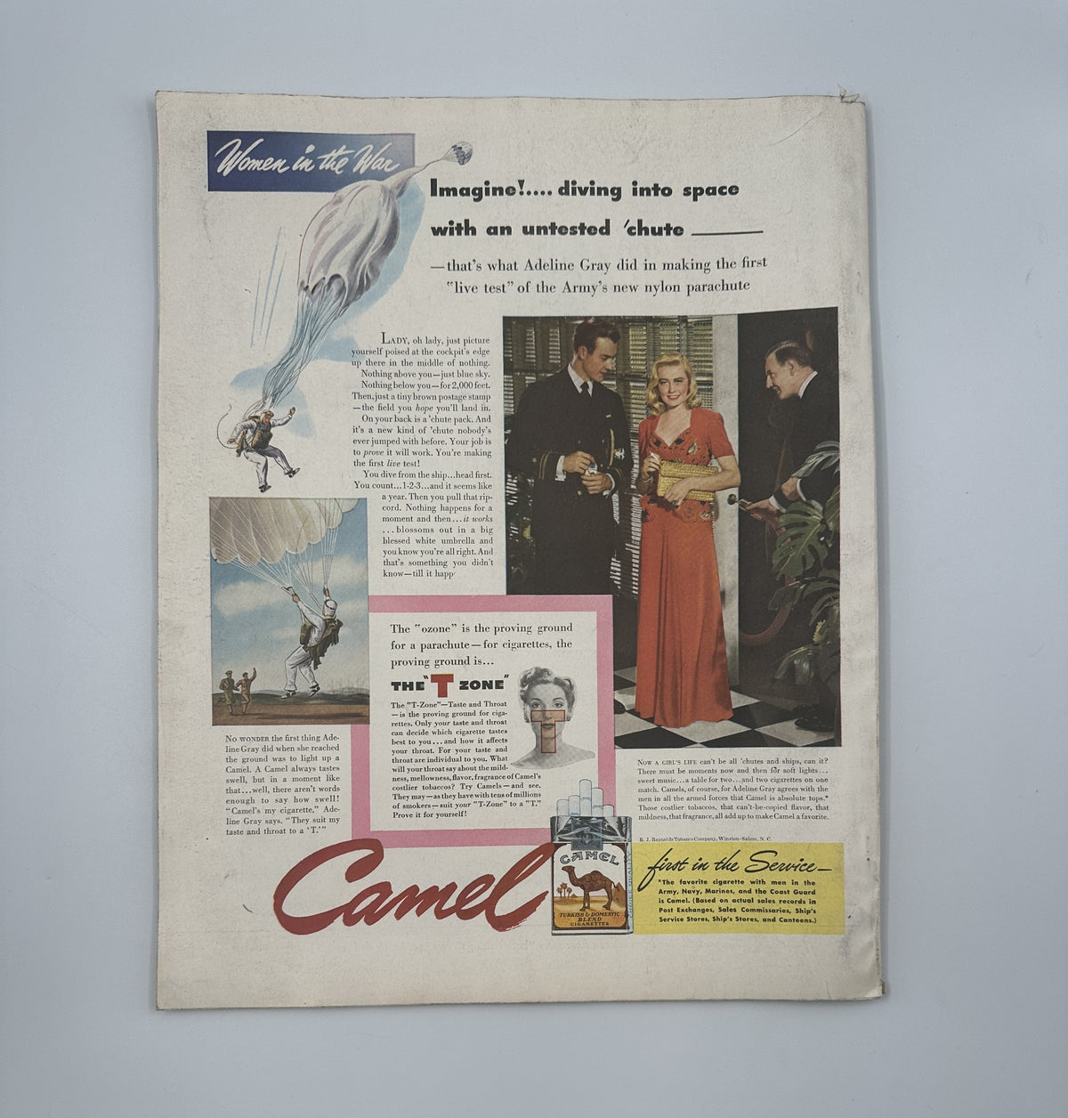 Cover of the Woman’s Home Companion Magazine January 1943 featuring an advertisement for Camel cigarettes, illustrating a woman parachuting with the caption 'Imagine!... diving into space with an untested chute.' This issue includes notable works like 'Flight for Freedom' by Horace McCoy.